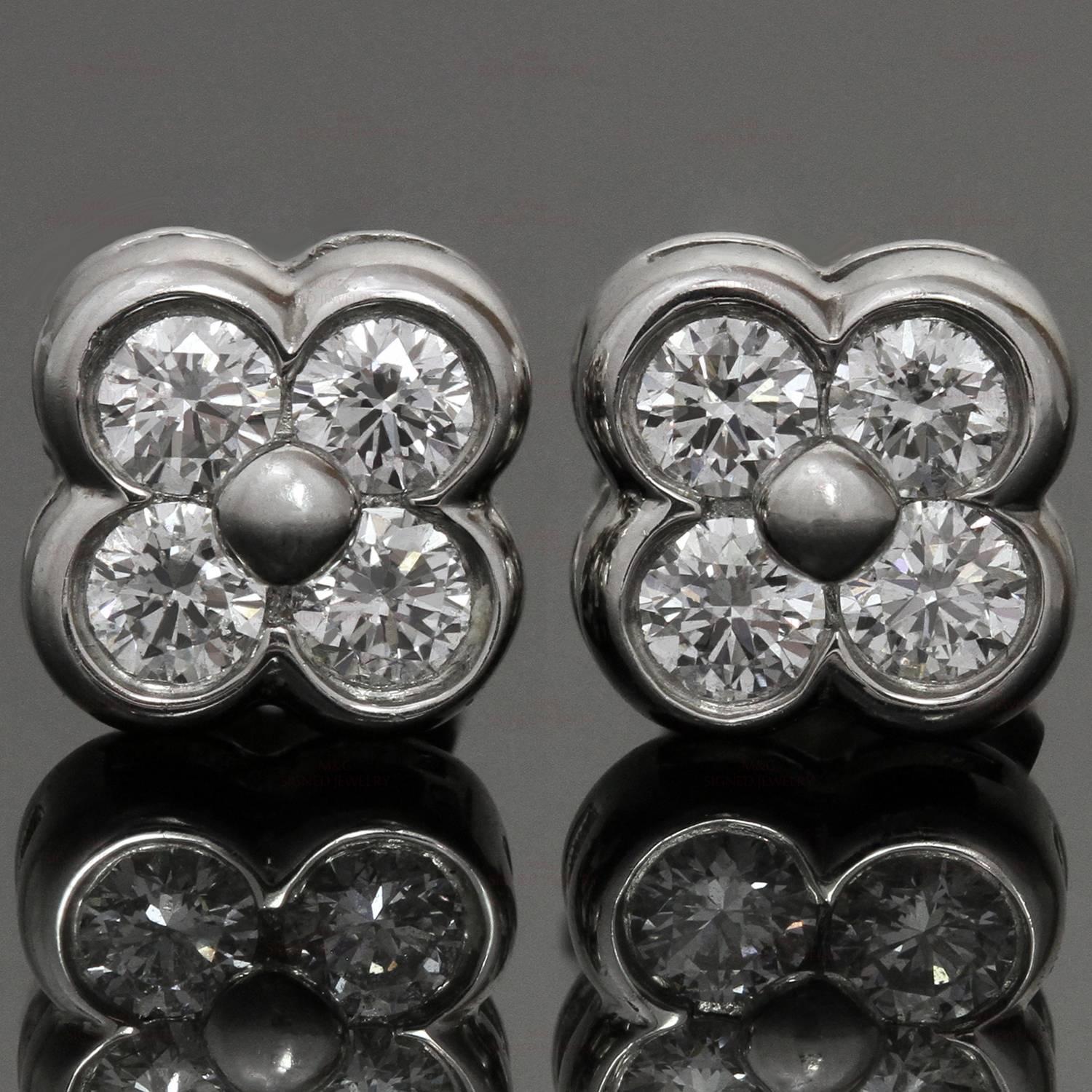 These exquisite Tiffany & Co. flower-shaped stud earrings are crafted in platinum and bezel-set with brilliant-cut round E-F VVS1-VVS2 diamonds of an estimated 0.58 carats. Made in United States circa 2000s. Classic and timeless.  Measurements: