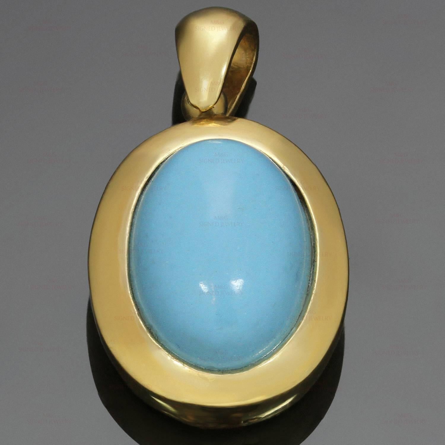 This elegant estate pendant is crafted in 18k yellow gold and set with an oval turquoise stone. Made in Italy circa 1980s. Measurements: 0.55" (14mm) width, 0.98" (25mm) length. 