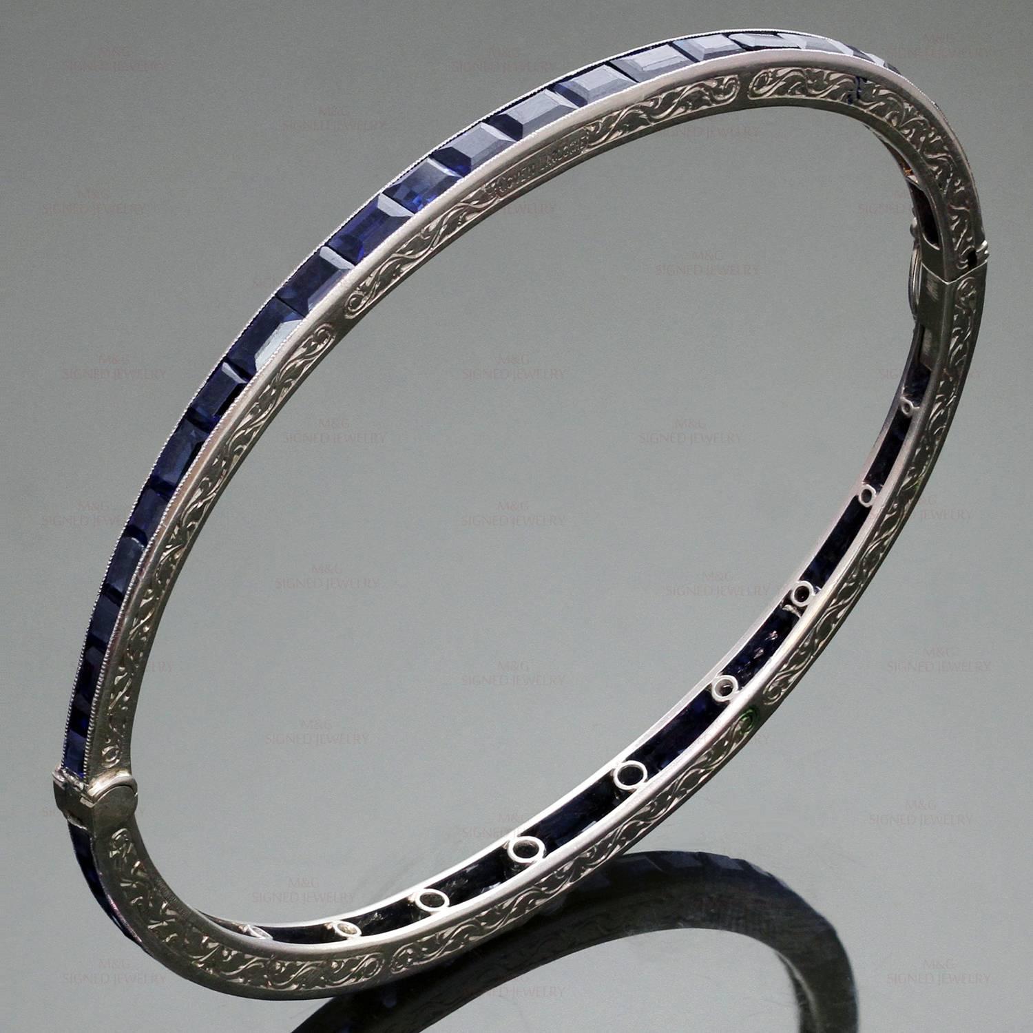 This timeless Coven-LaCloche art deco bracelet features a delicate filligree design hand-crafted in platinum and set with 56 french-cut genuine blue sapphires. The stones are slightly abraded. Made in France circa 1920s. Measurements: 0.11"