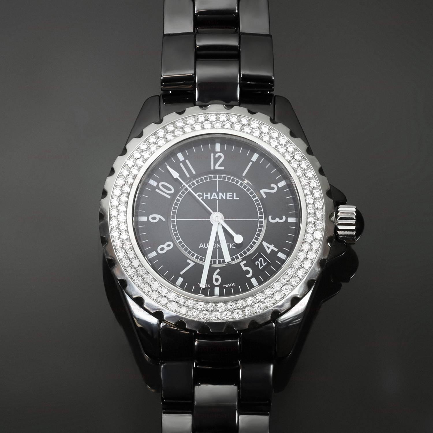 This stunning Cha nel J12 women's wristwatch features a scratch-resistant high gloss black ceramic case with a black ceramic bracelet, a fixed stainless steel bezel set with factory-original diamonds, a black 38mm dial with silver-tone hands and