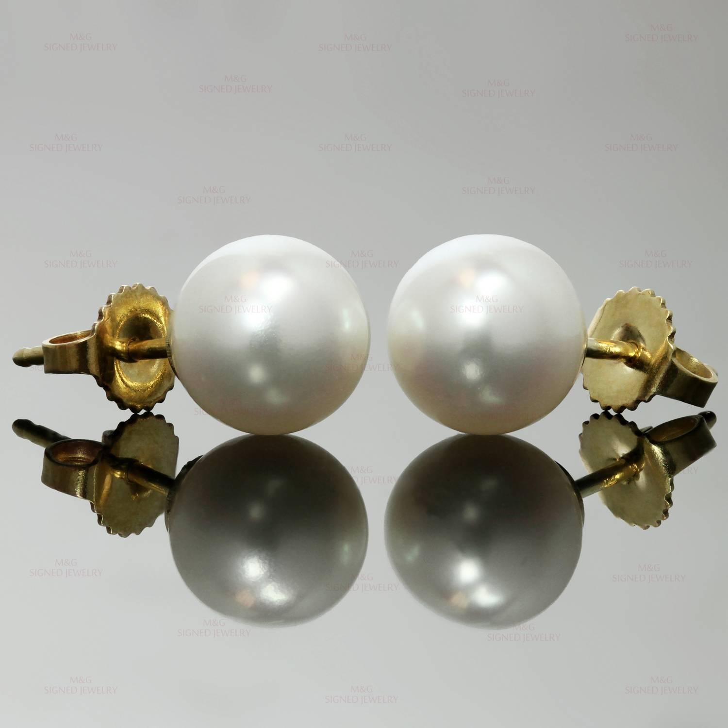 These classic Tiffany earrings are crafted in 18k yellow gold and set with Akoya Cultured Pearls measuring between 8.5mm to 9.0mm.  Made in United States circa 2000s. Measurements: 0.35" (9mm) width. 