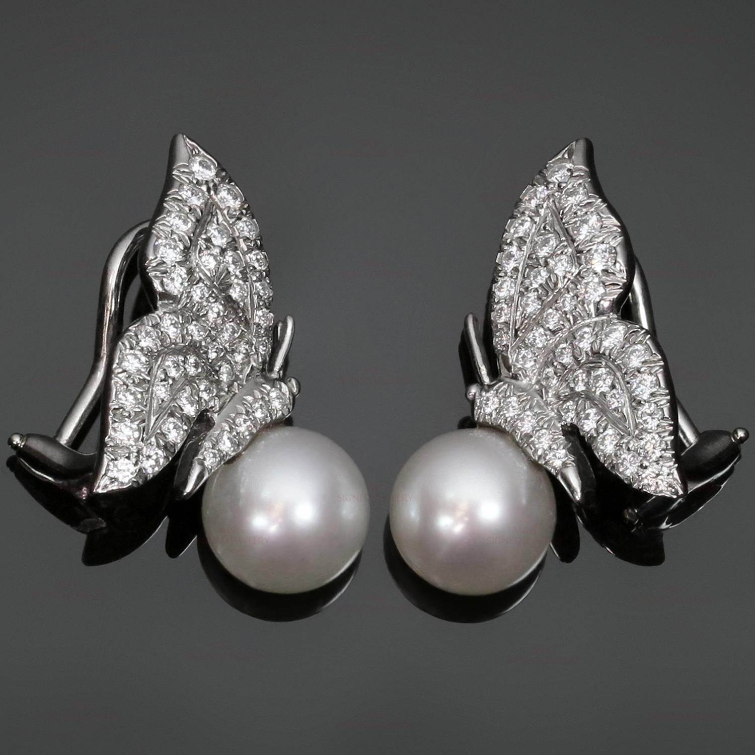 These fabulous Tiffany clip-on earrings feature an elegant butterfly design crafted in platinum and pave-set with sparkling brilliant-cut round diamonds of an estimated 1.12 carats and completed with cultured pearls measuring an estimated 8.0mm.