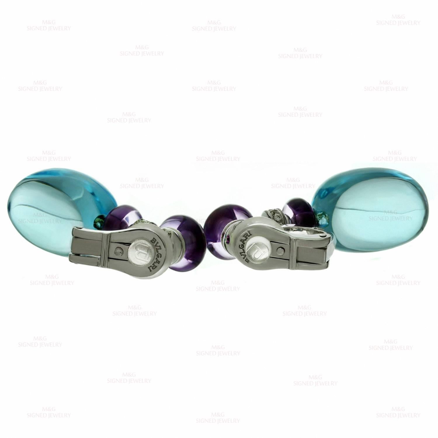 These gorgeous clip-on earrings from Bulgari's Sassi collection are crafted in 18k white gold, set with brilliant-cut round diamonds and completed cabochon amethyst rondels and cabochon blue topaz droplets. Made in Italy circa 2010s. Measurements: