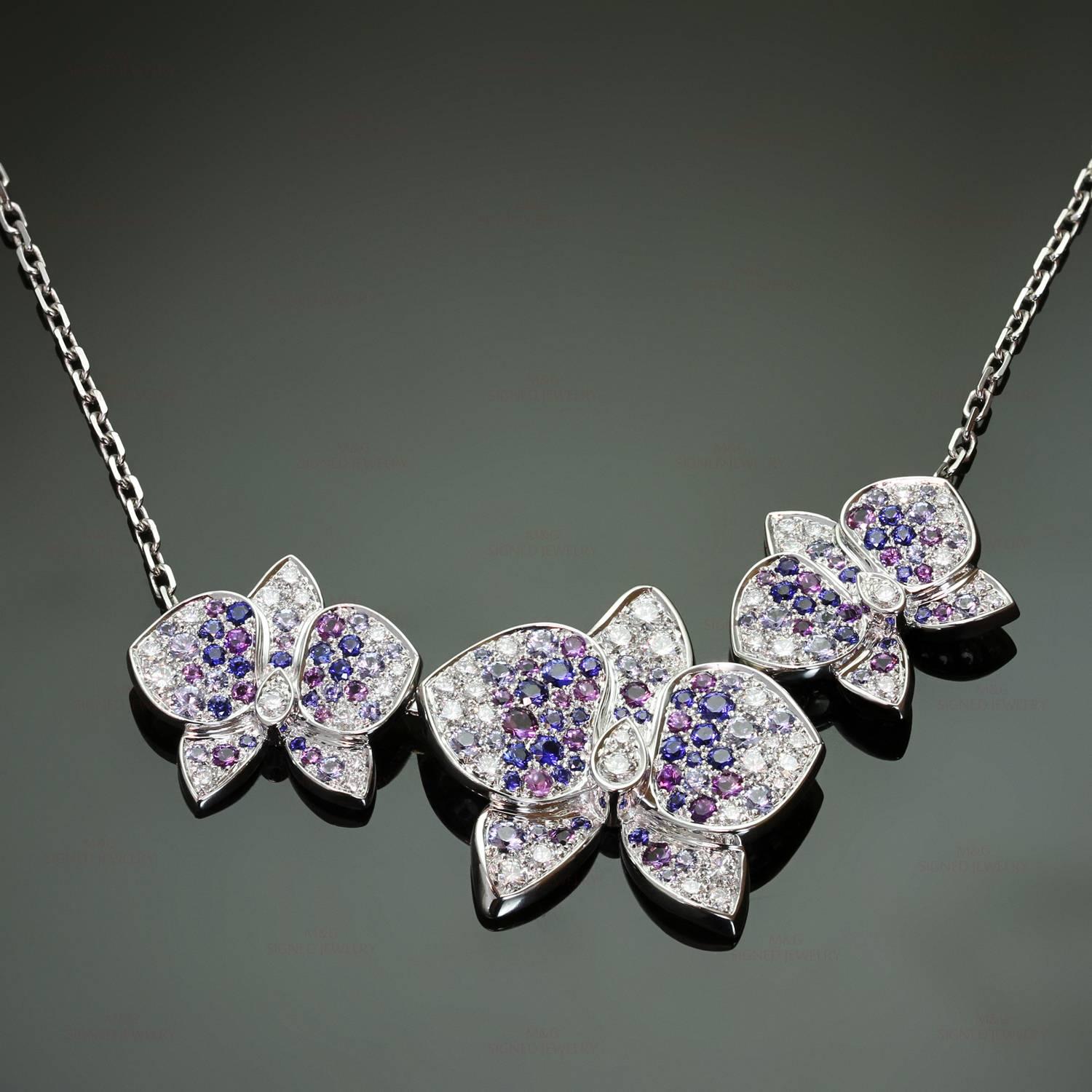 This magnificent necklace from the stunning Caresse D'Orchidees collection is crafted in 18k white gold and completed with a sparkling orchid-shaped pendant set with brilliant-cut diamonds, amethysts, and sapphires. Made in France circa 2010s.