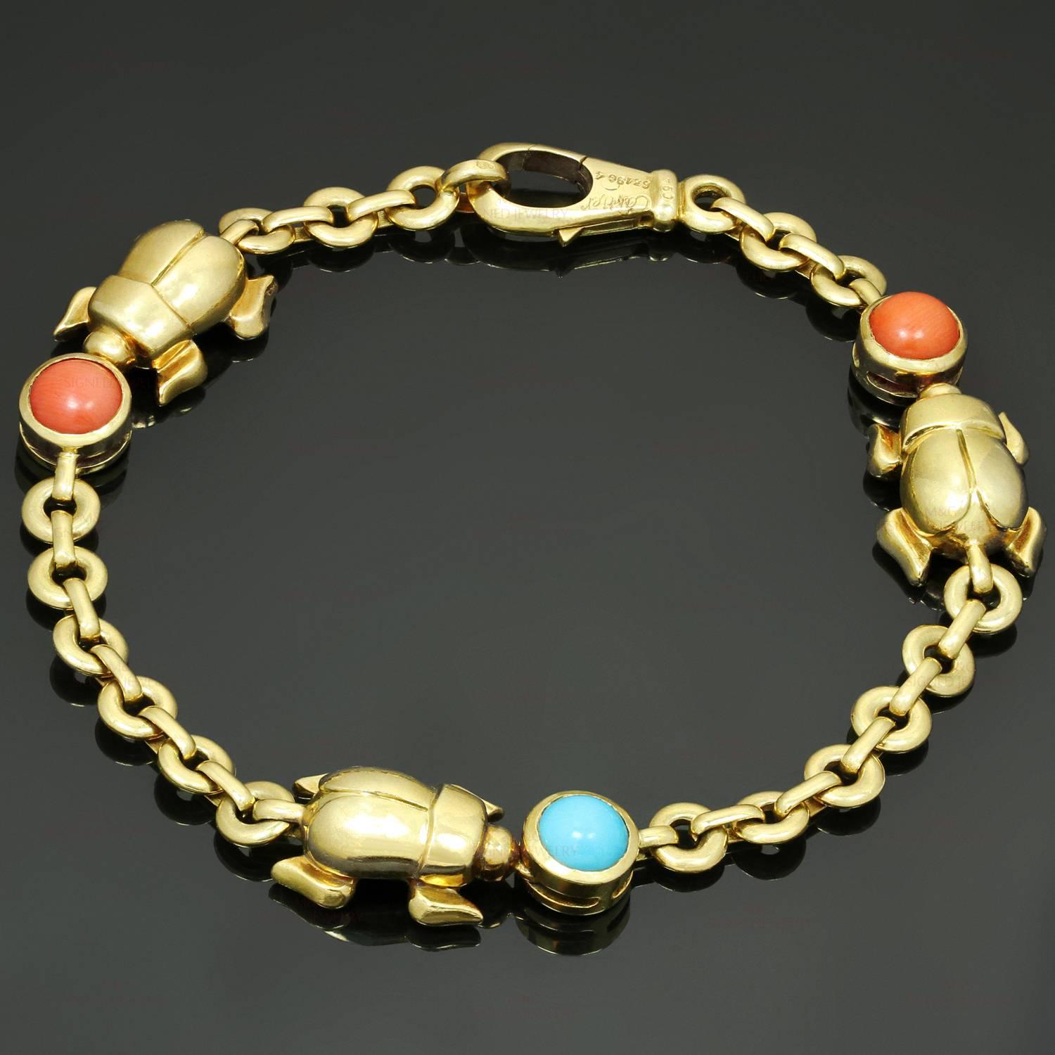 This rare Cartier bracelet is crafted in 18k yellow gold and features 3 timeless bettle-shaped motifs set with a round turquoise and a pair of corals. Made in France circa 1990s. Measurements: 0.43" (11mm) width, 7" (17.7cm) length. 