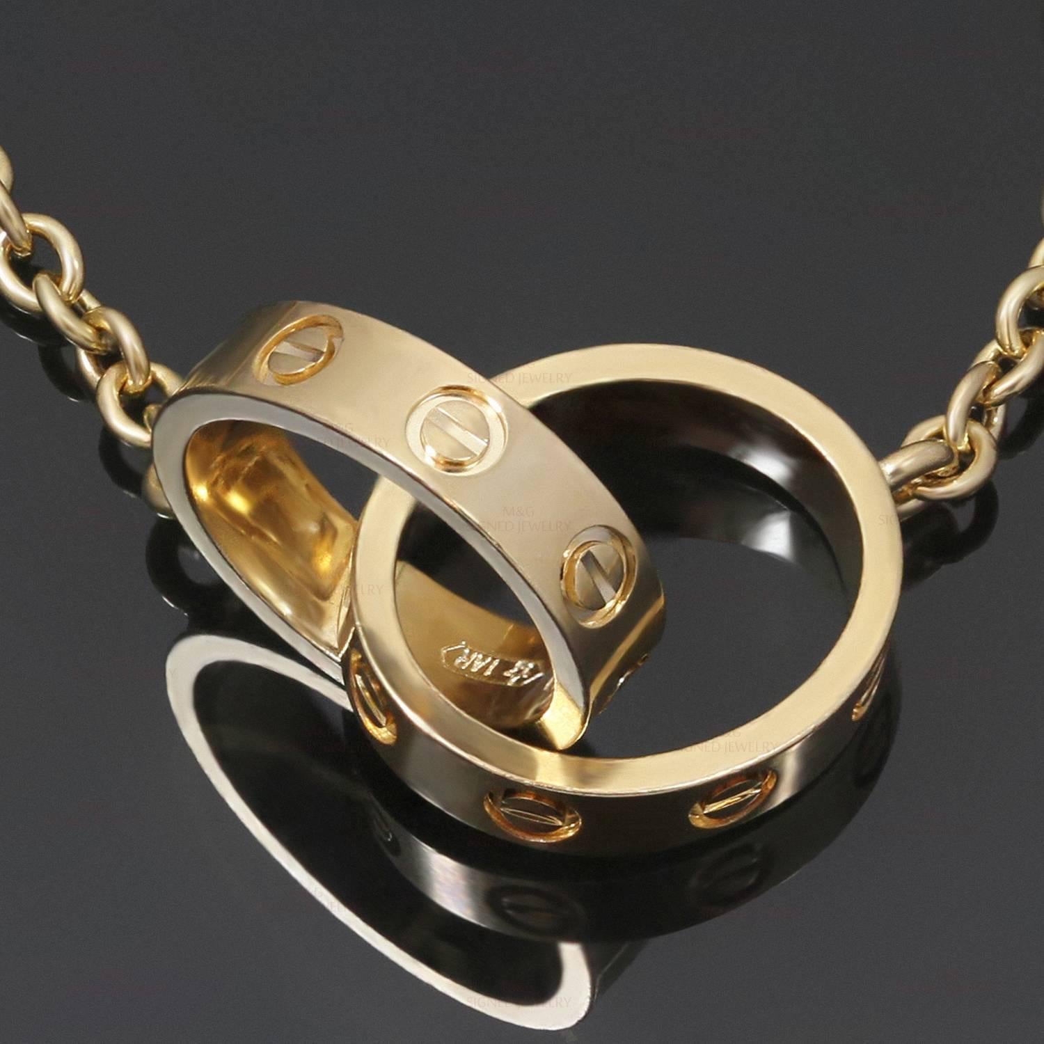 This classic necklace from Cartier's iconic Love collection features the ideal oval shape of the screw motifs on a pair of interconnected rings crafted in 18k yellow gold. Made in France circa 2010s. Measurements: 0.51