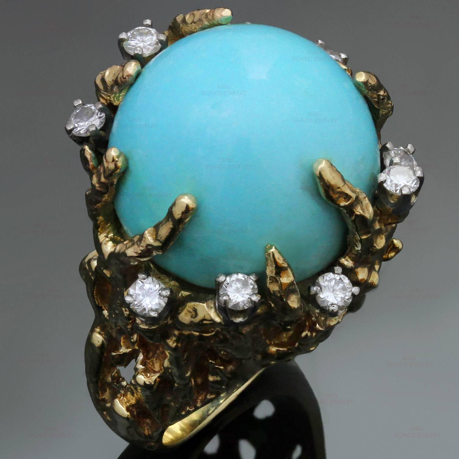This stunning vintage cocktail ring is crafted in 14k nugget yellow gold and set with an oval cabochon turquoise measuring an estimated 16.6mm x 16.8mm, surrounded with brilliant-cut round diamonds of an estimated 0.50 carats. Made in United States