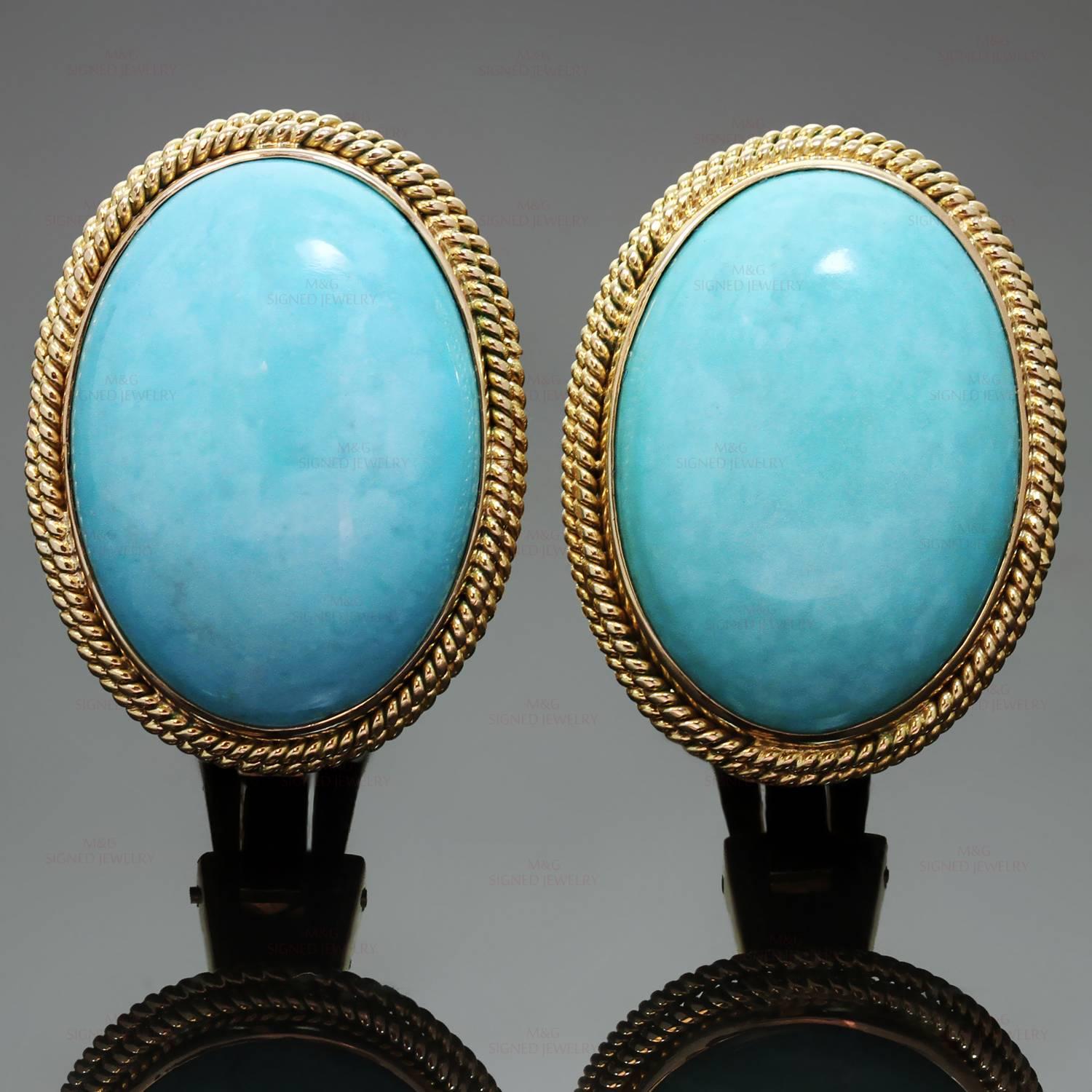 These elegant retro clip-on earrings are crafted in 14k yellow gold and set with genuine Arizona turquoise stones. The oval stones measure an estimated 17.2mm by 24.0mm. Made in United States circa 1960s. Measurements: 0.86" (22mm) width,