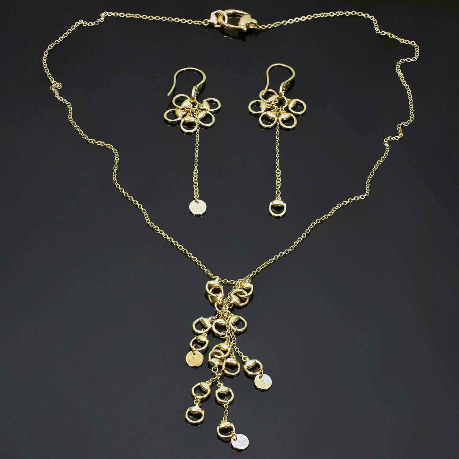 This chic Gucci set from the fabulous horsebit collection is crafted in 18k yellow gold and consists of dangling french wire earrings and a chain necklace with a dangling drop. Made in Italy circa 2010s. Measurements: 2 5/8