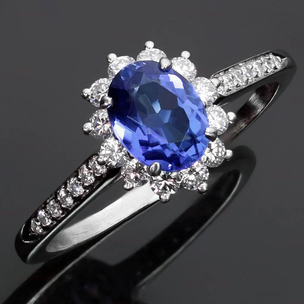 This gorgeous Tiffany ring is crafted in platinum and set with genuine faceted tanzanite of an estimated 1.26 carats and brilliant-cut round diamonds of an estimated 0.40 carats. Made in United States circa 2000s. Measurements: 0.43" (11mm)