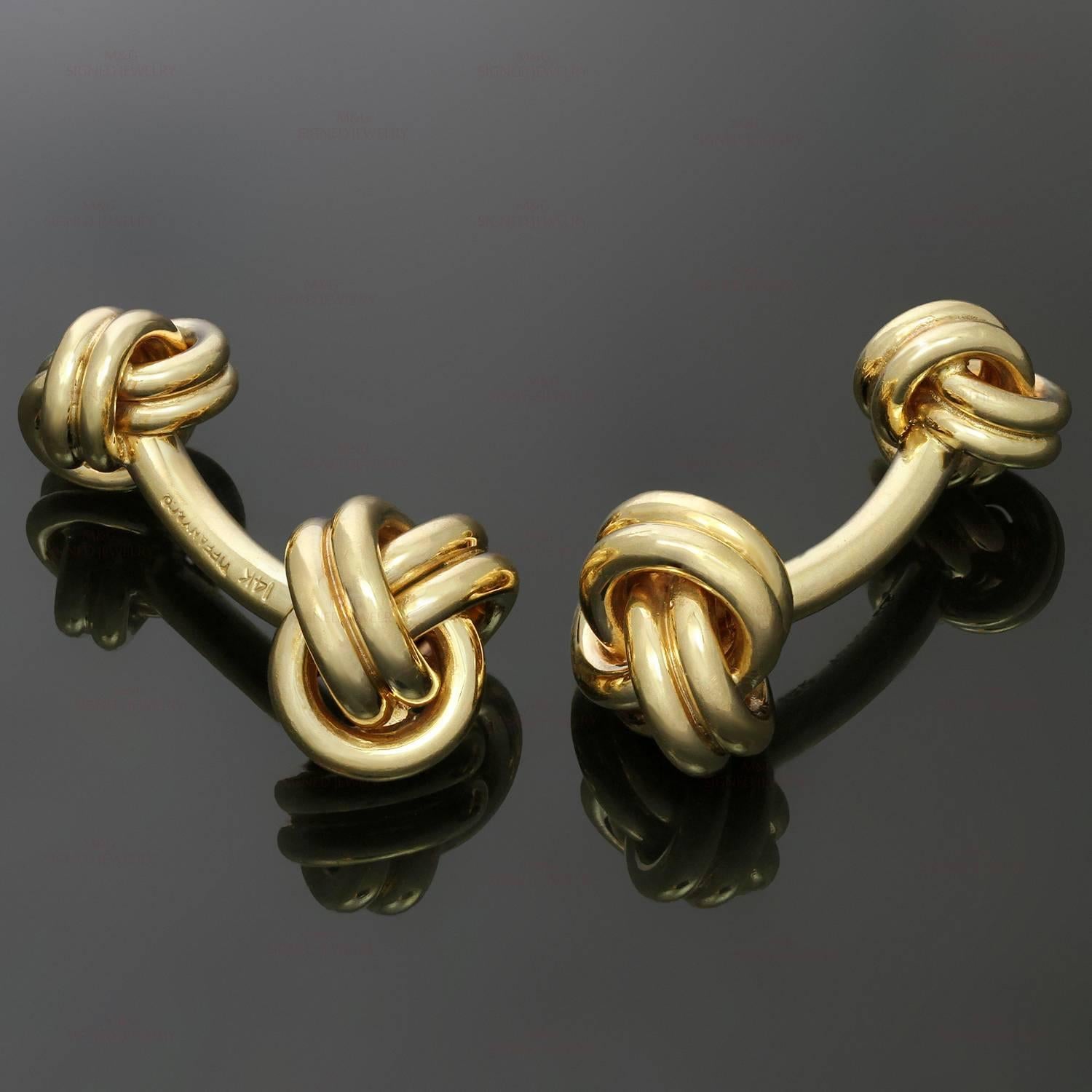 These classic Tiffany cufflinks feature the iconic Love Knot design crafted in 14k yellow gold. Made in United States circa 1990s. Measurements: 0.51" (13mm) width, 0.90" (23mm) length. 