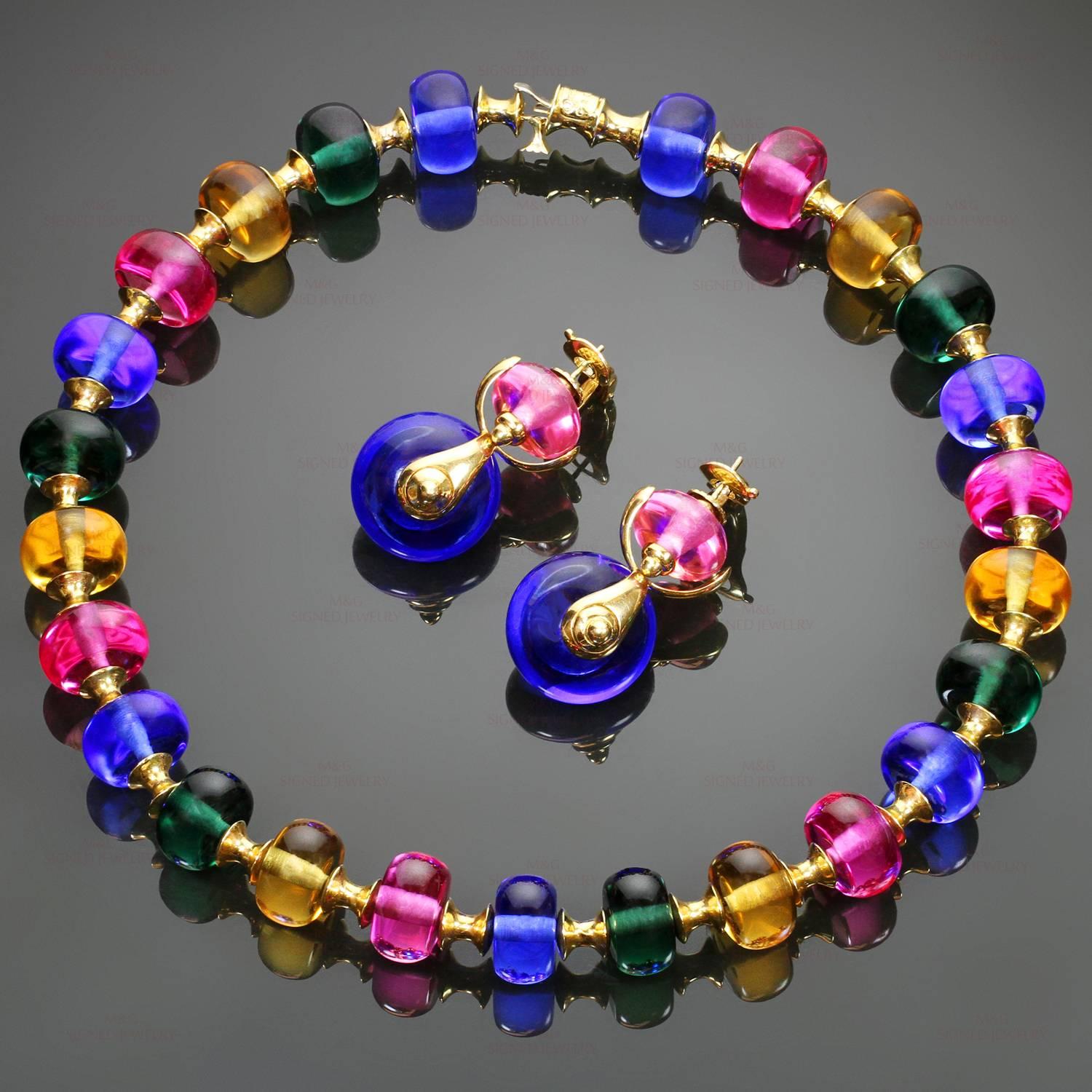 This fabulous jewelry set from Marina B's colorful Cimin collection is crafted in 18k yellow gold and features a necklace designed as a series of polished beads in blue, green, yellow, & pink quartz, connected by tapered barrel-shaped links and