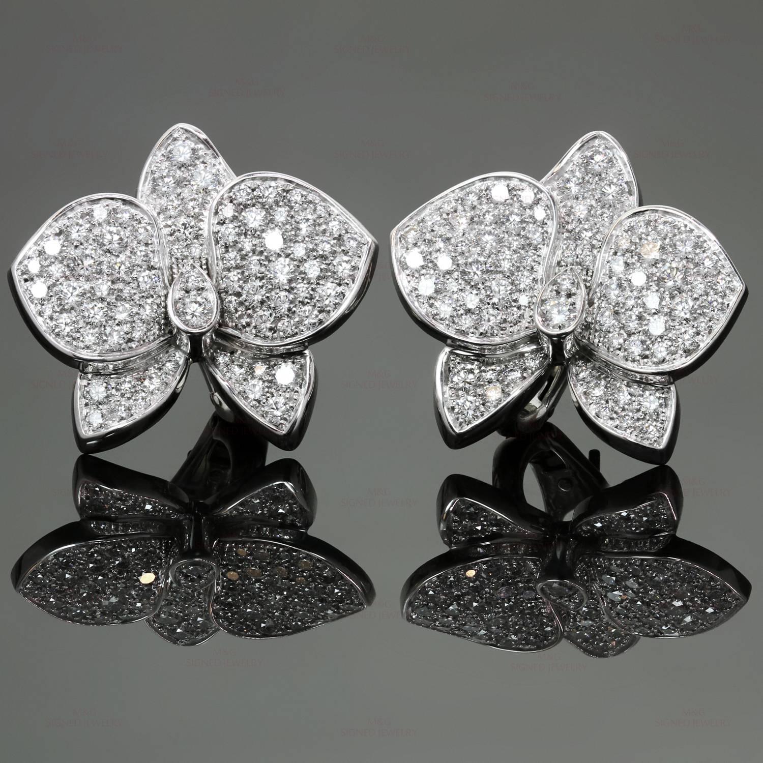 These exquisite earrings from Cartier's Caresse D'orchidees collection feature a delicate flower design crafted in 18k white gold and pave set with brilliant-cut round diamonds of an estimated 2.90 carats. Made in France circa 2000s. Measurements: