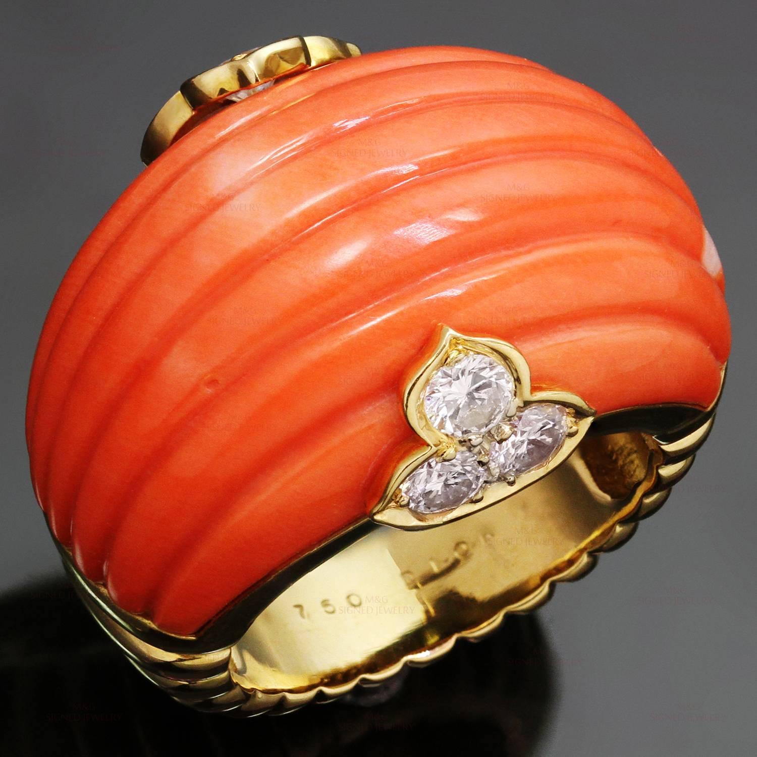 This rare retro Christian Dior ring is crafted in 18k yellow gold and features a fluted natural coral in a ridged band accented with brilliant-cut round diamonds of an estimated 0.78 carats. Made in France circa 1970s. Measurements: 0.98"