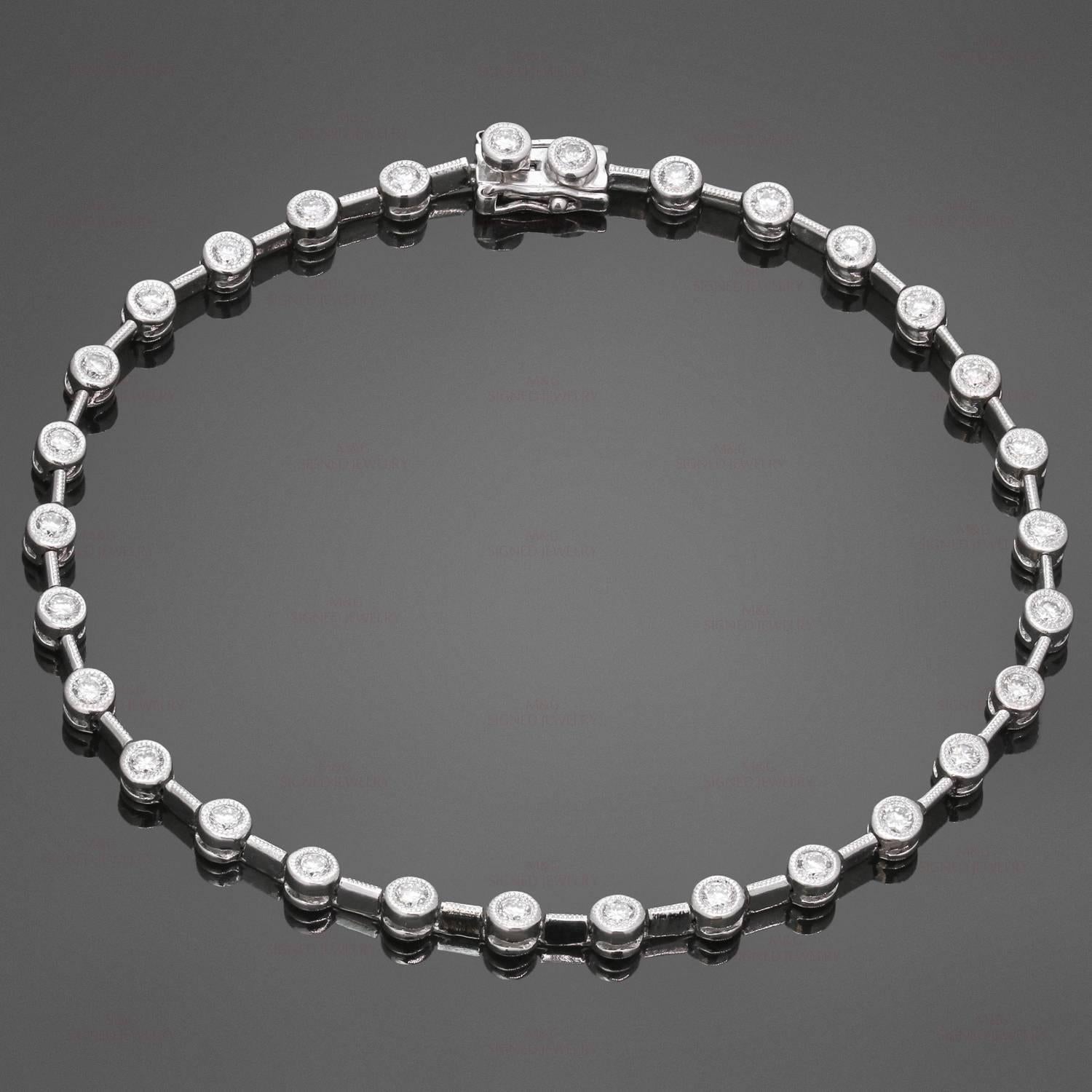 This classic tennis bracelet is crafted 18k white gold and elegantly bezel-set with brilliant-cut round diamonds of an estimated 1.50 carats. Made in United States circa 1990s. Measurements: 0.11" (3mm) width, 7.5" (19.5cm) length. 
