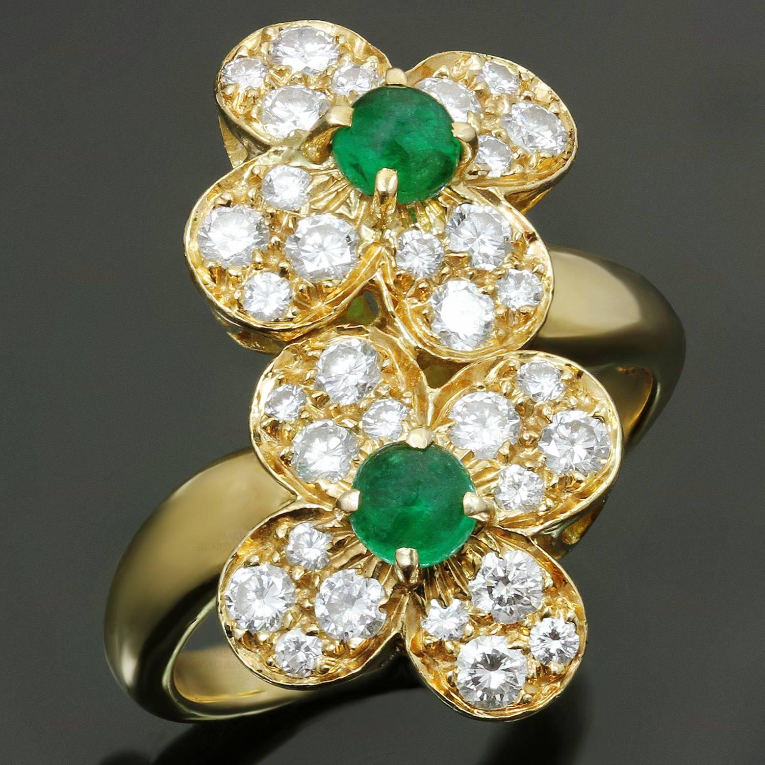 This stunning Van Cleefs & Arpels ring from the classic Trefle collection is crafted in 18k yellow gold and features a double clover flower motif set with round cabochon emeralds and brilliant-cut round diamonds of an estimated 0.65 carats. Made