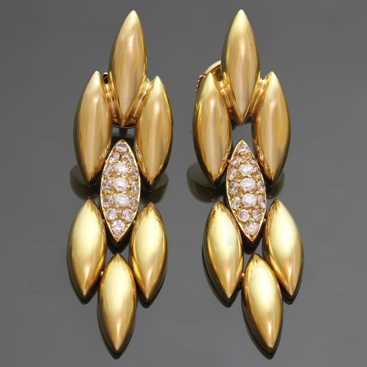 These chic earrings from the iconic Gentiane collection features a fluid almond shape link design made in 18k yellow gold and set with 30 brilliant-cut round E-F VVS1-VVS2 diamonds of an estimated 0.75 carats. Made in France circa 1980s.