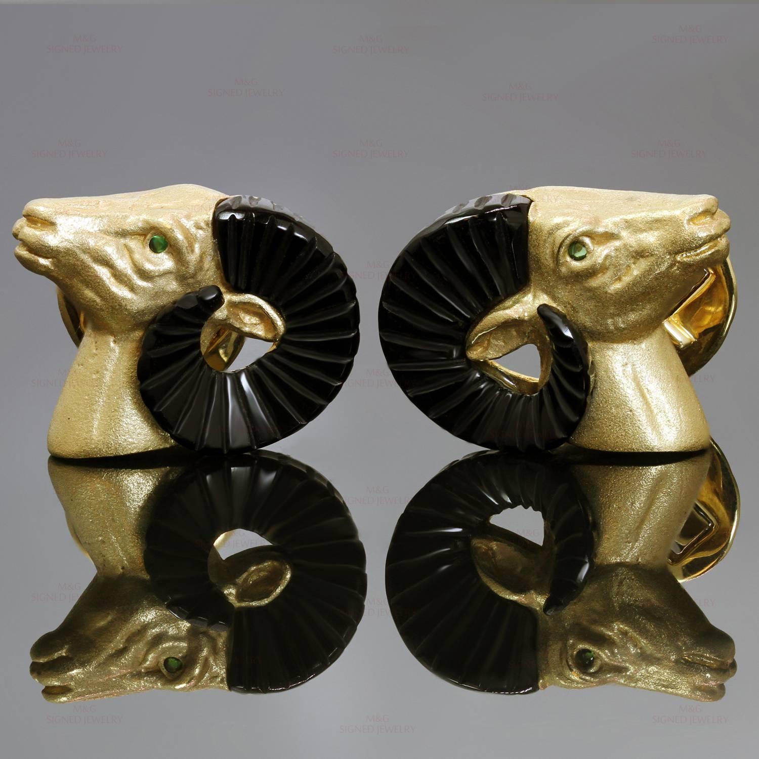 These stunning Safari cufflinks feature a rams head design crafted in 18k yellow gold and accented with cabochon emerald eyes and black onyx horns. Made in United Kingdon circa 1990s. Measurements: 0.90
