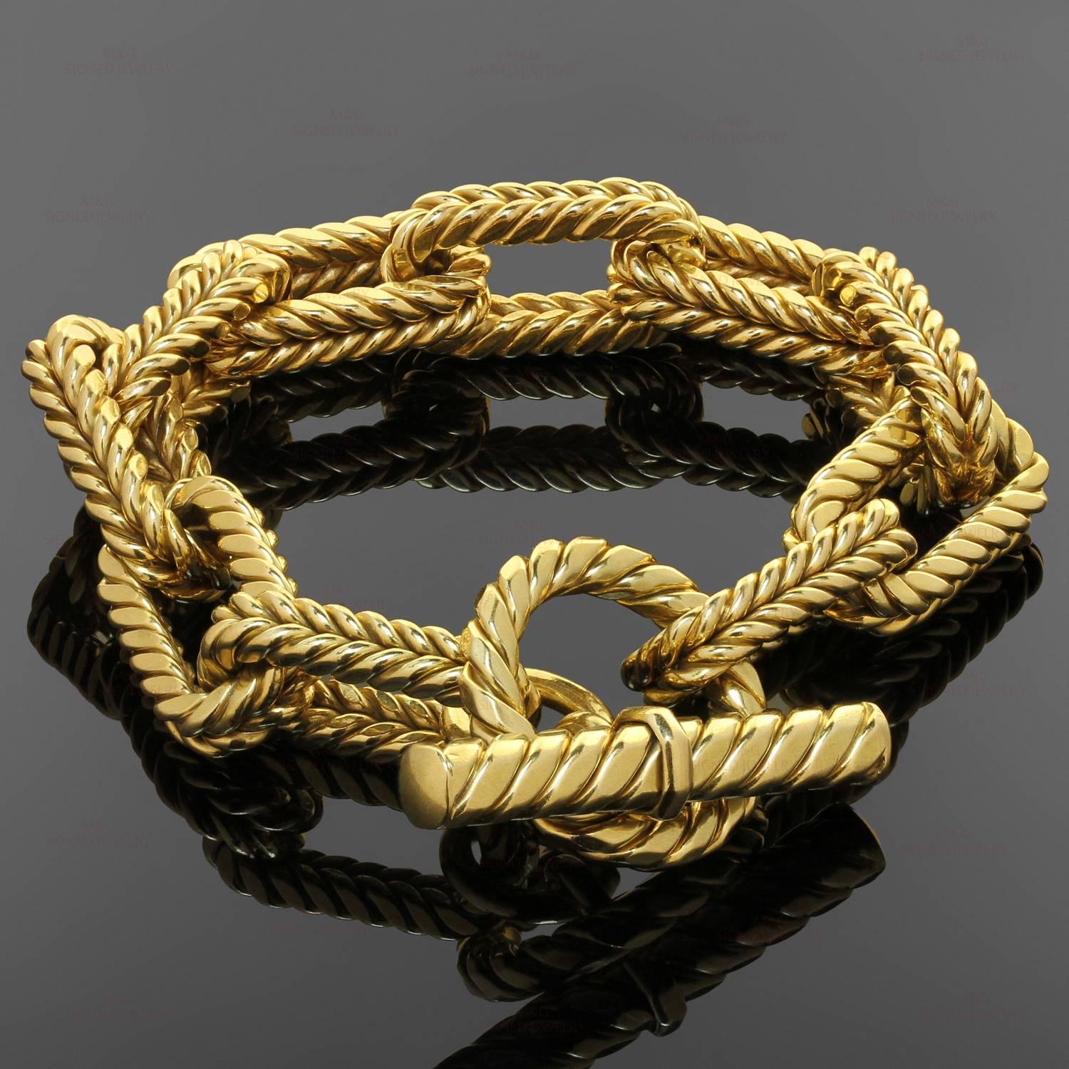 This classic toggle clasp bracelet features ridged rectangular links crafted in 18k yellow gold. Made in Italy circa 1980s. Measurements: 0.51