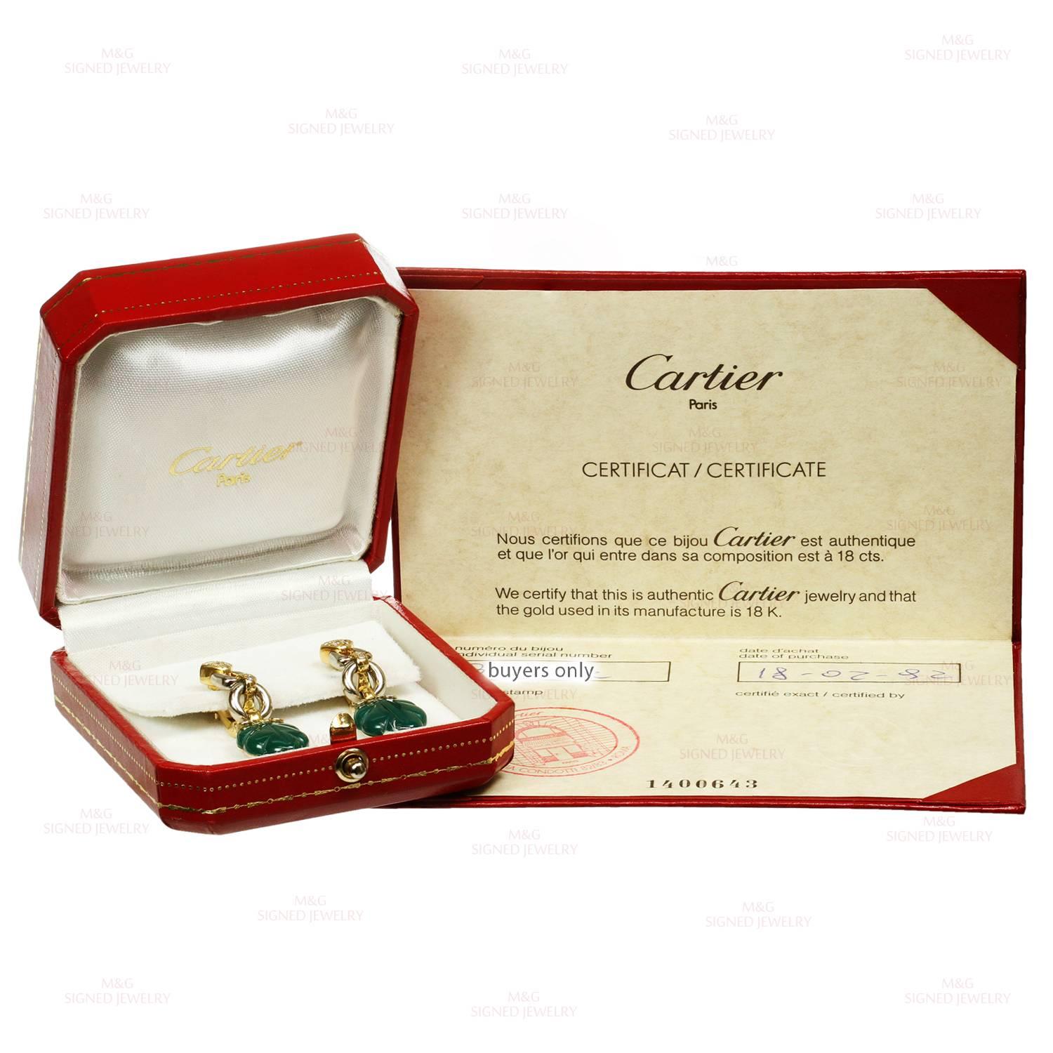 These fabulous Cartier earrings are crafted in 18k yellow & white gold and feature beautifully carved green onyx leafs accented with sparkling brilliant-cut round diamonds. Made in France circa 1990. Measurements: 0.51