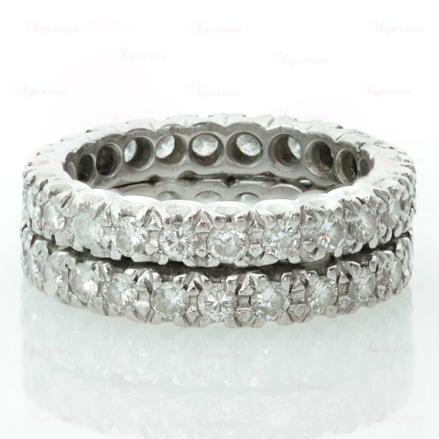 This elegant two-row eternity band is made in fine platinum and pave-set with an estimated 2.75 carats of sparkling round diamonds. A timeless romantic design. Measurements: 0.27