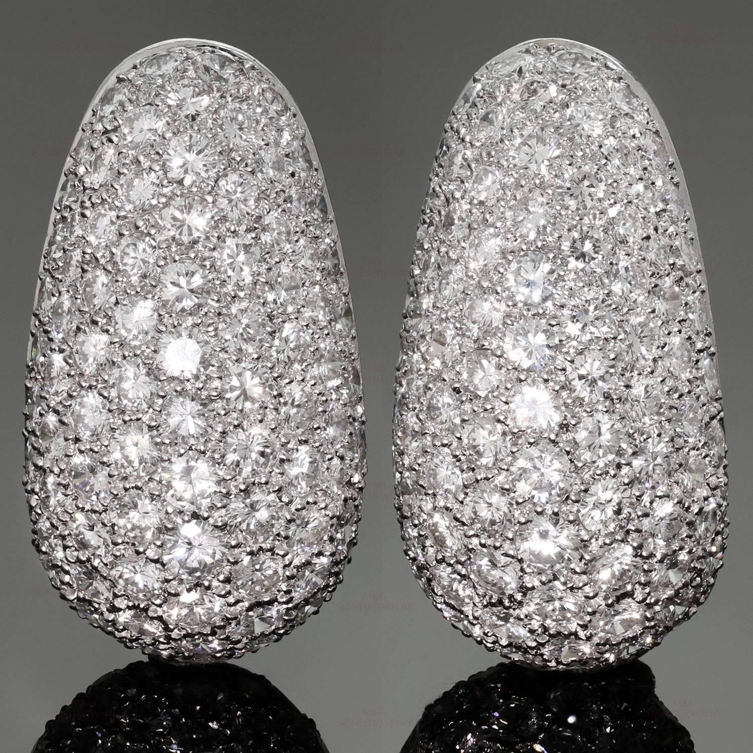 These magnificent Van Cleef & Arpels earrings are crafted in platinum and set with appxorimately 204 full-cut diamonds of an estimated 15.0 carats. Made in France circa 1975. Measurements: 0.66