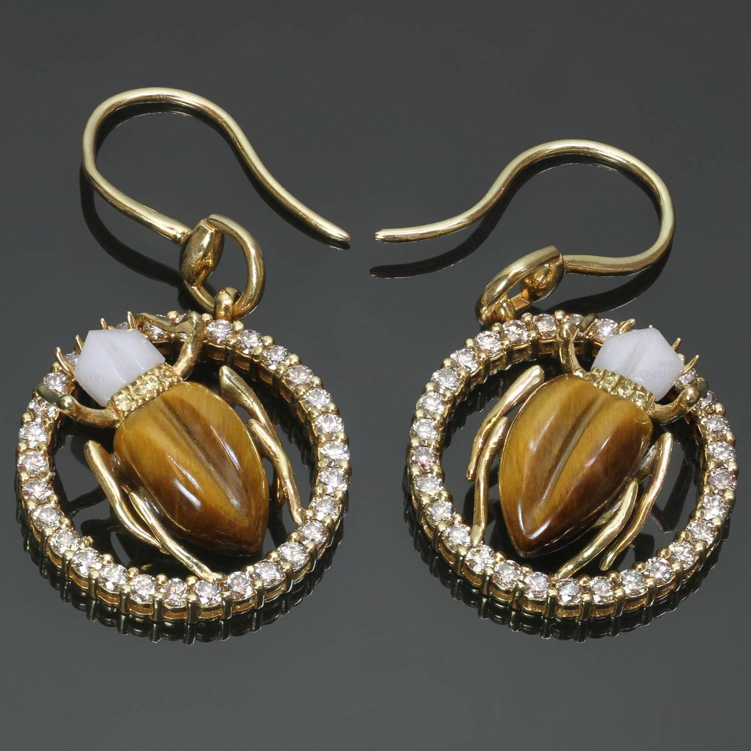 These lively and sparkling Gucci drop earrings feature a scarab beetle design crafted in 18k yellow gold and accented with champagne diamonds of an estimated 1.80 carats, yellow sapphire, white agate, and tiger's eye. Made in Italy circa 2000s. 
