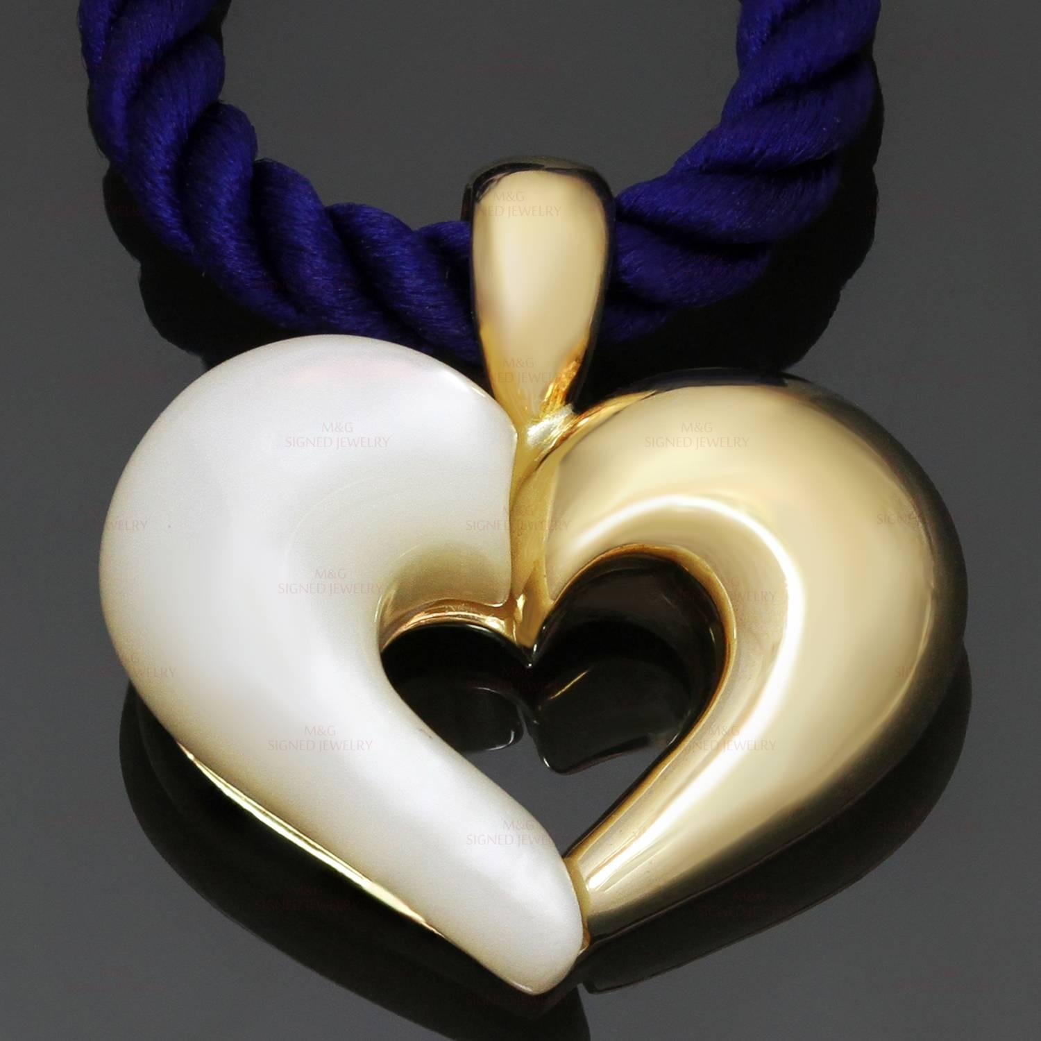 This graceful Van Cleef & Arpels heart pendant is crafted in 18k yellow gold and mother-of-pearl and completed with a blue silk cord. Made in United States circa 1990s. Measurements: 0.90