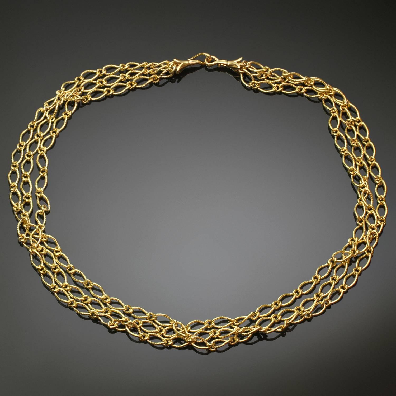 This elegant necklace features 3 rows of chained links crafted in 18k yellow gold. Made in Italy circa 1990s. Measurements: 16.5