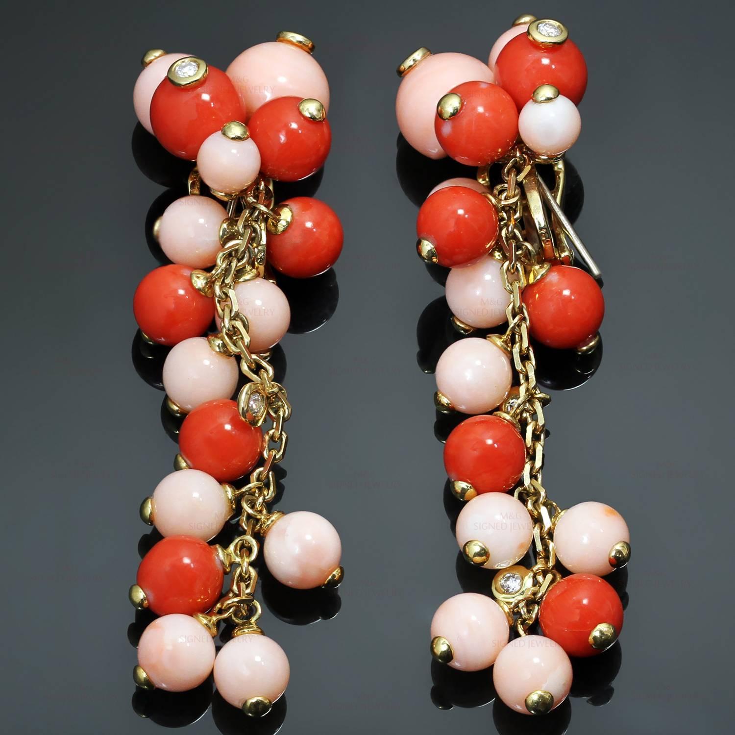 These beautiful earrings feature pinkish and reddish coral beads ranging in size from 5.30mm to 9.40mm, accented with full-cut diamonds of an estimated 0.28 carats, and set in 18k yellow gold. These earrings are designed for both pierced and