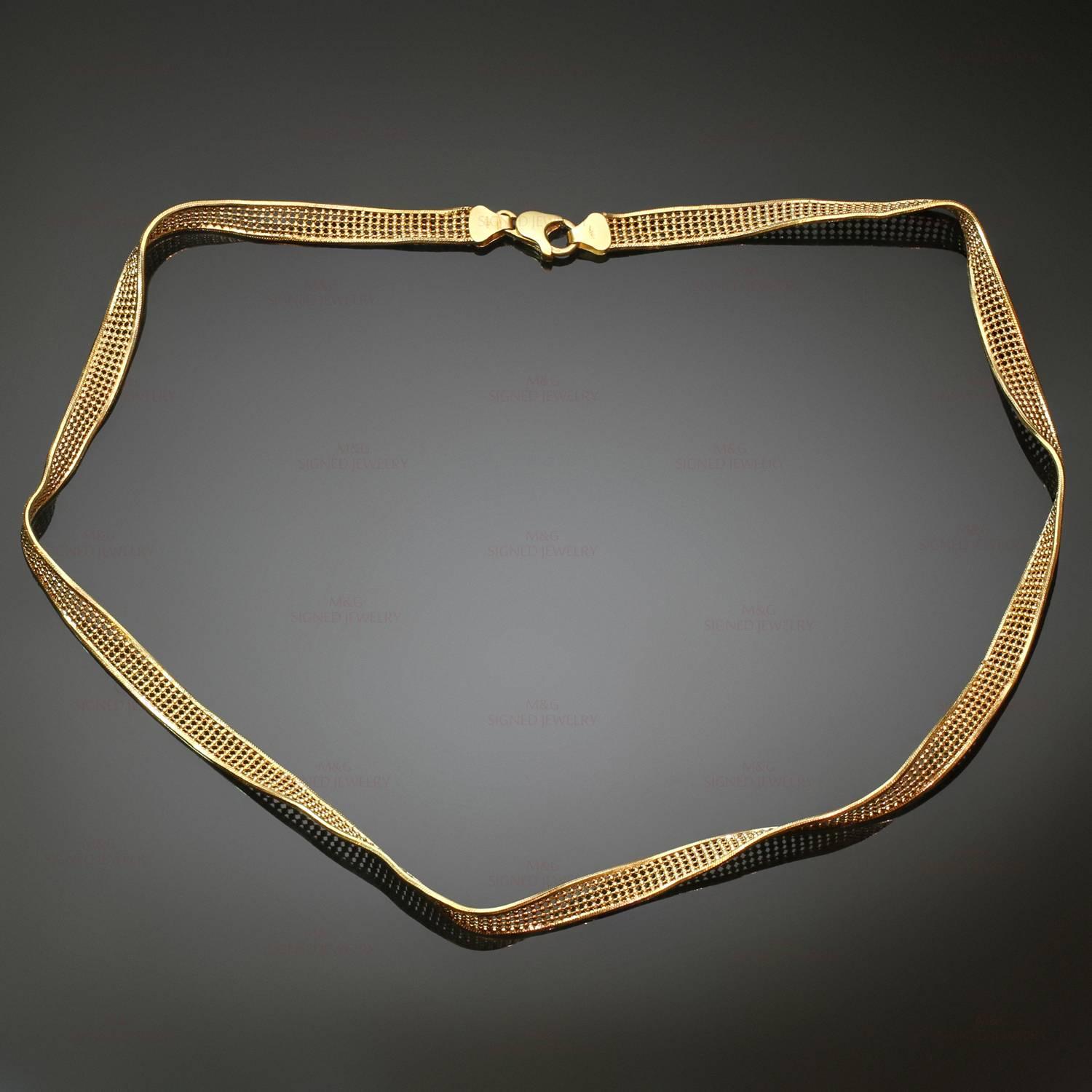 This classic necklace features a twisted mesh design crafted in 18k yellow gold. Made in Italy circa 1990s. Measurements: 0.23