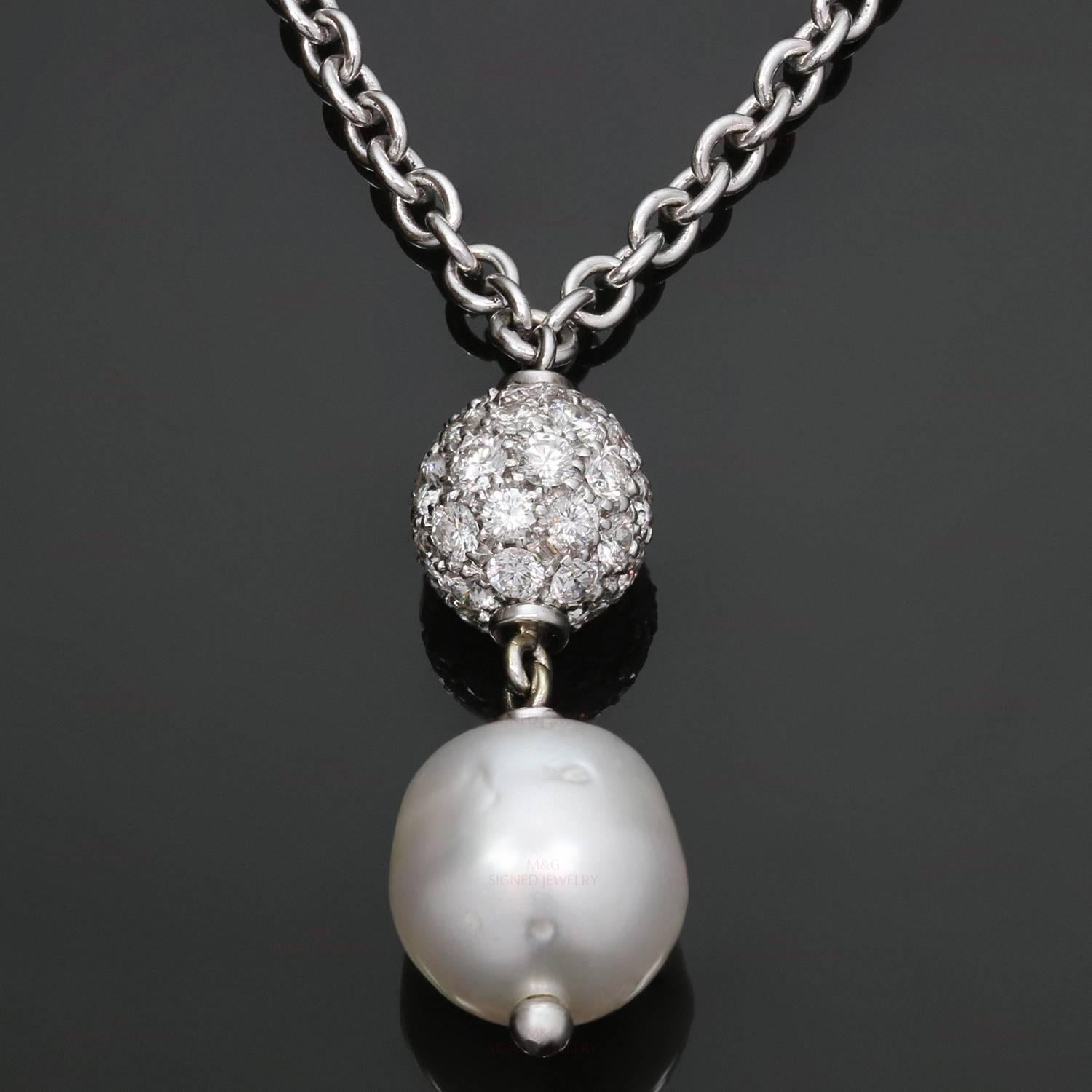 This elegant and timeless necklace is made in 18k white gold and features a beautiful 11.0mm Baroque South See pearl suspended from a pave-set diamond ball and completed by a circular link chain. Measurements: 27mm drop, 16