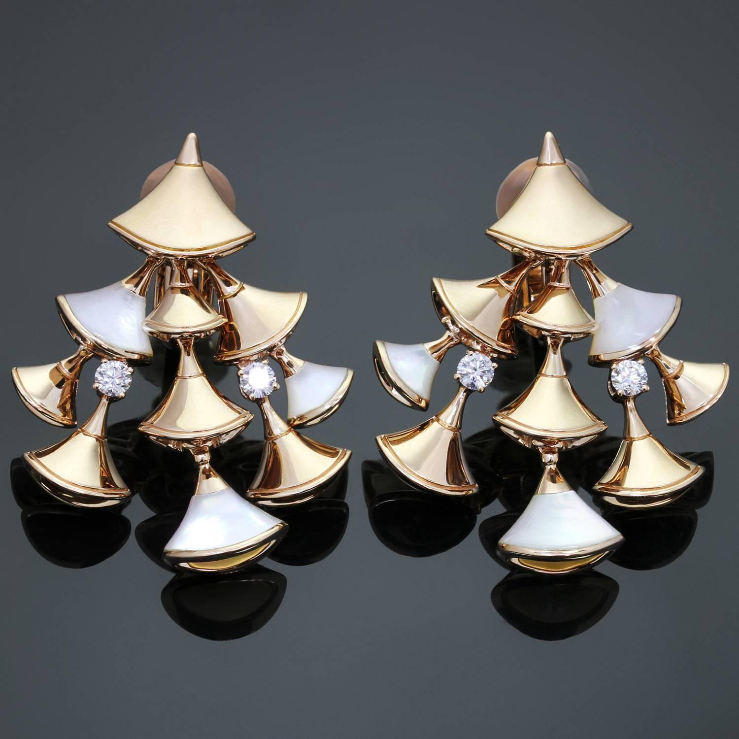 These sophisticated clip-on earring's from Bulgari's Divas' Dream collection feature a cascade of fan-shaped motifs crafted in 18k rose gold and beautifully accented with mother-of-pearl and 4 sparkling brilliant-cut round diamonds. The classic