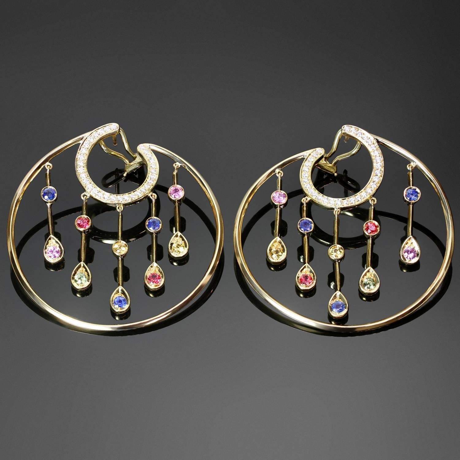 These gorgeous 18k yellow gold hoop earrings from the La Pluie collection by Chanel feature a circular design accented with dangling drops and are set with brilliant-cut round diamonds of an estimated 0.60 carats and colorful faceted round sapphires