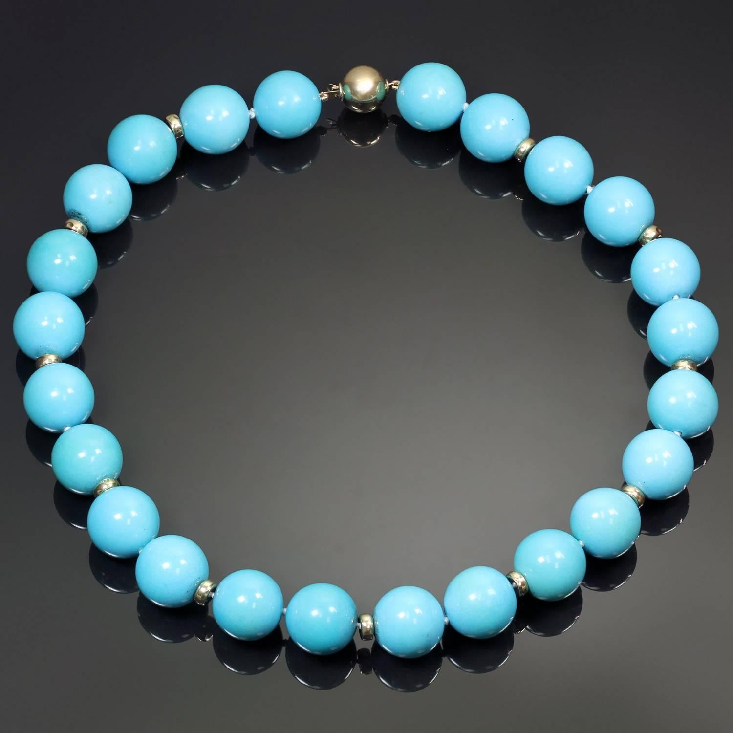 The fabulous necklace is composed of natural turquoise beads of stunning blue color, measuring 16.70 mm to 17.10 mm, and accented wit gold rondelles and a 14k gold clasp. A bold statement piece.  Measurements: 18