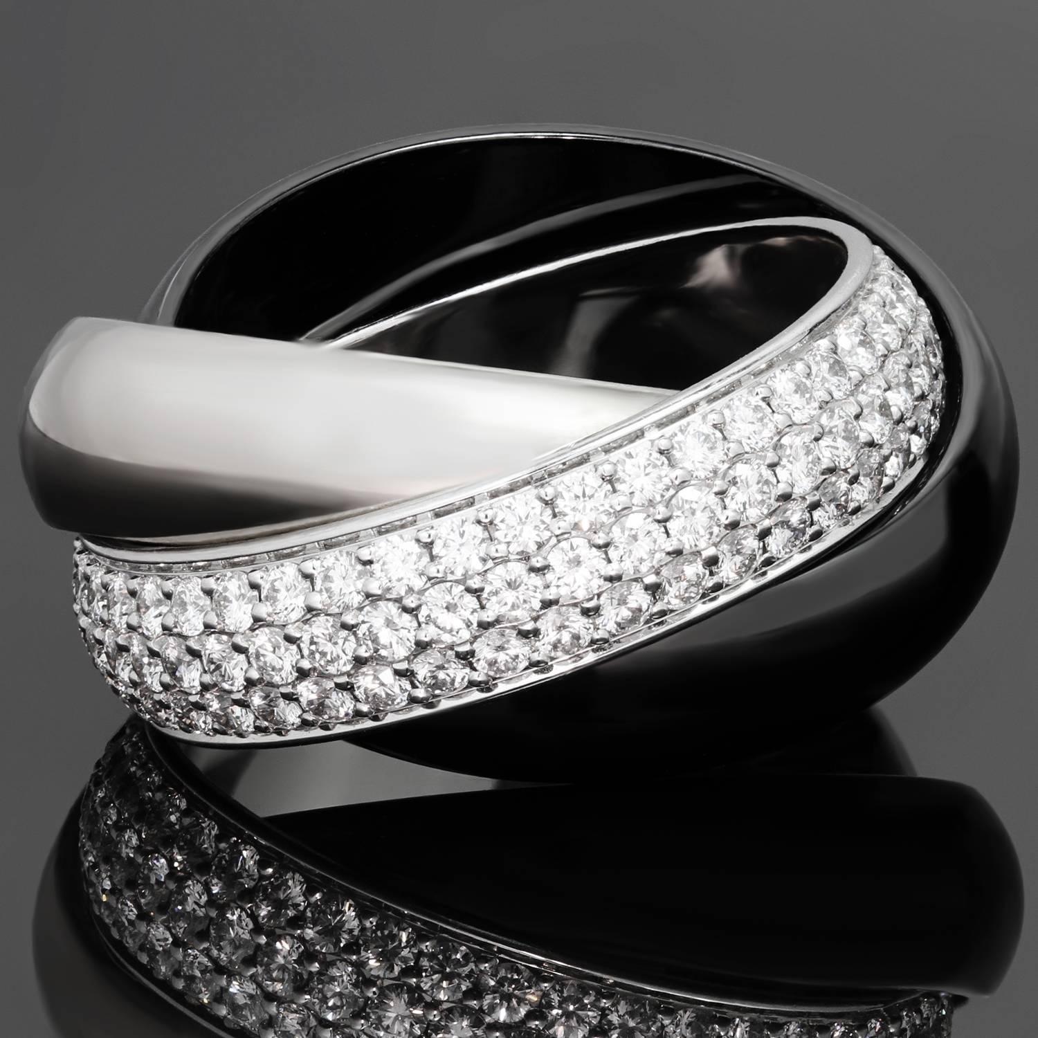 This fabulous ring from the Trinity de Cartier collection features 3 interconnected bands, crafted in 18k white gold and black ceramic and accented with about 129 round brilliant-cut diamonds of an estimated 1.54 carats. This is the large model of
