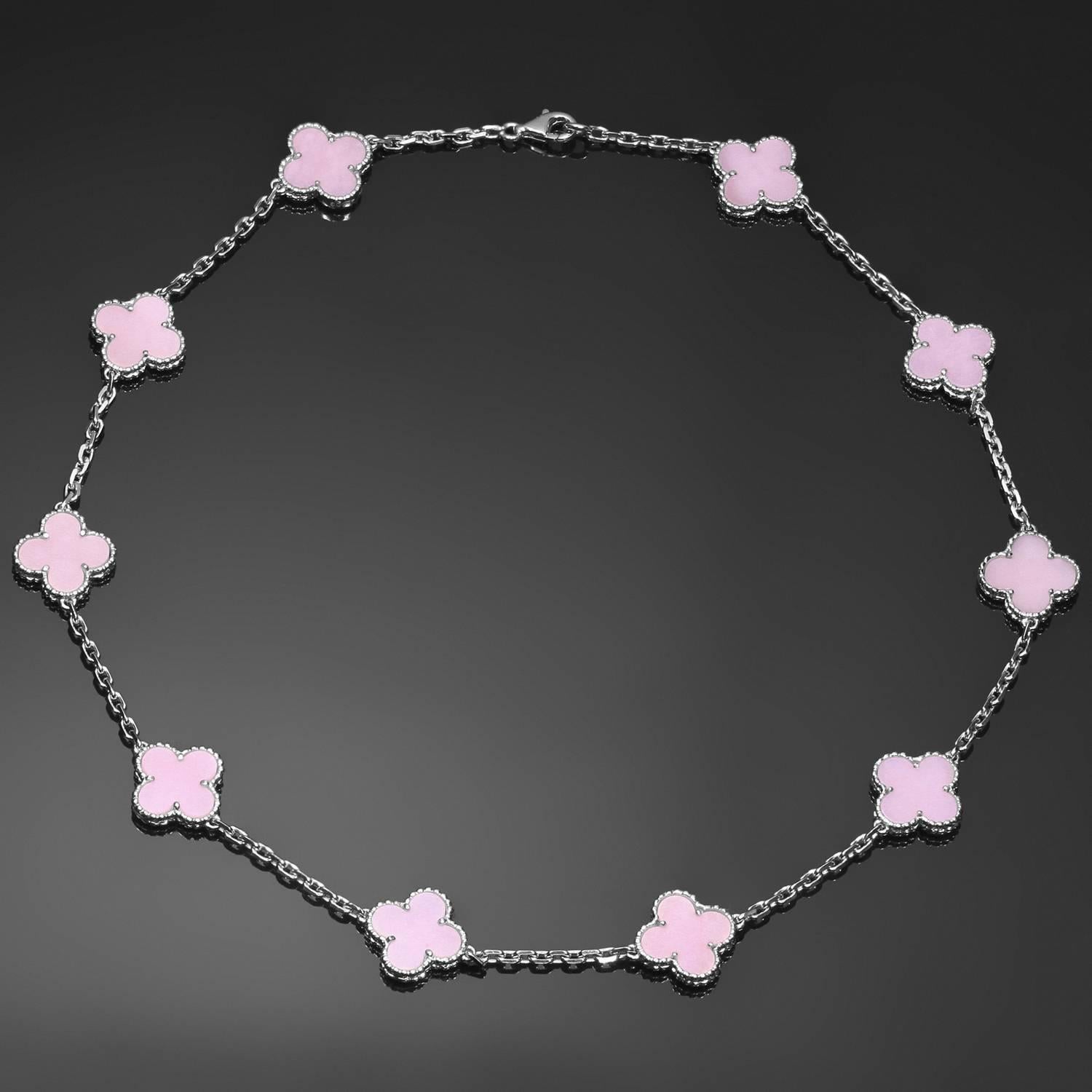 This splendid Van Cleef & Arpels necklace from the iconic Alhambra collection is crafted in 18k white gold and features 10 lucky clover motifs beautifully inlaid with natural pink opal in round bead settings. This extremely rare necklace has
