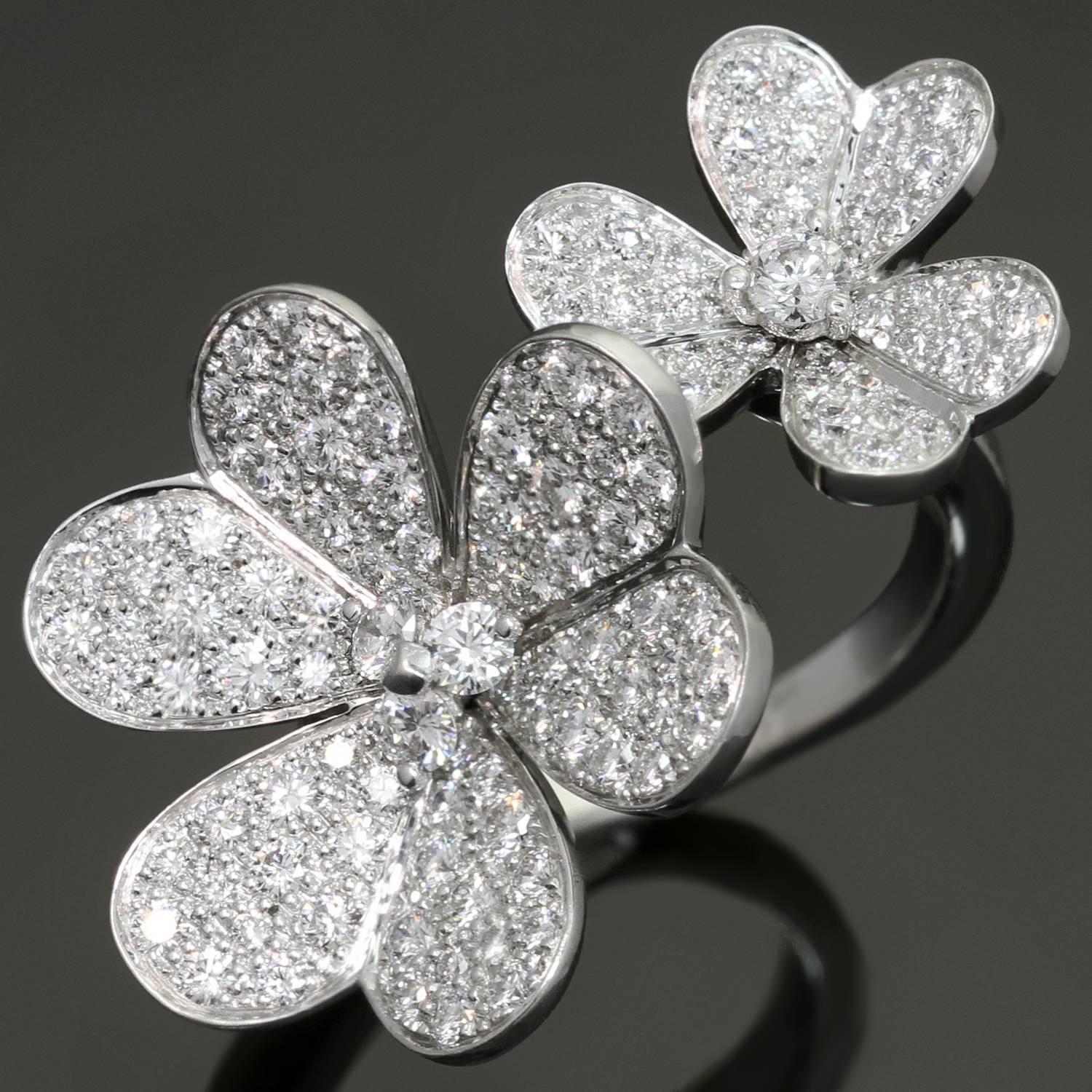 This fabulous between-the-finger ring from the iconic Frivole collection features a sparkling two flower design crafted in 18k white gold and set with about 112 brilliant-cut round diamonds of an estimated 2.10 carats. The ring size is adjustable