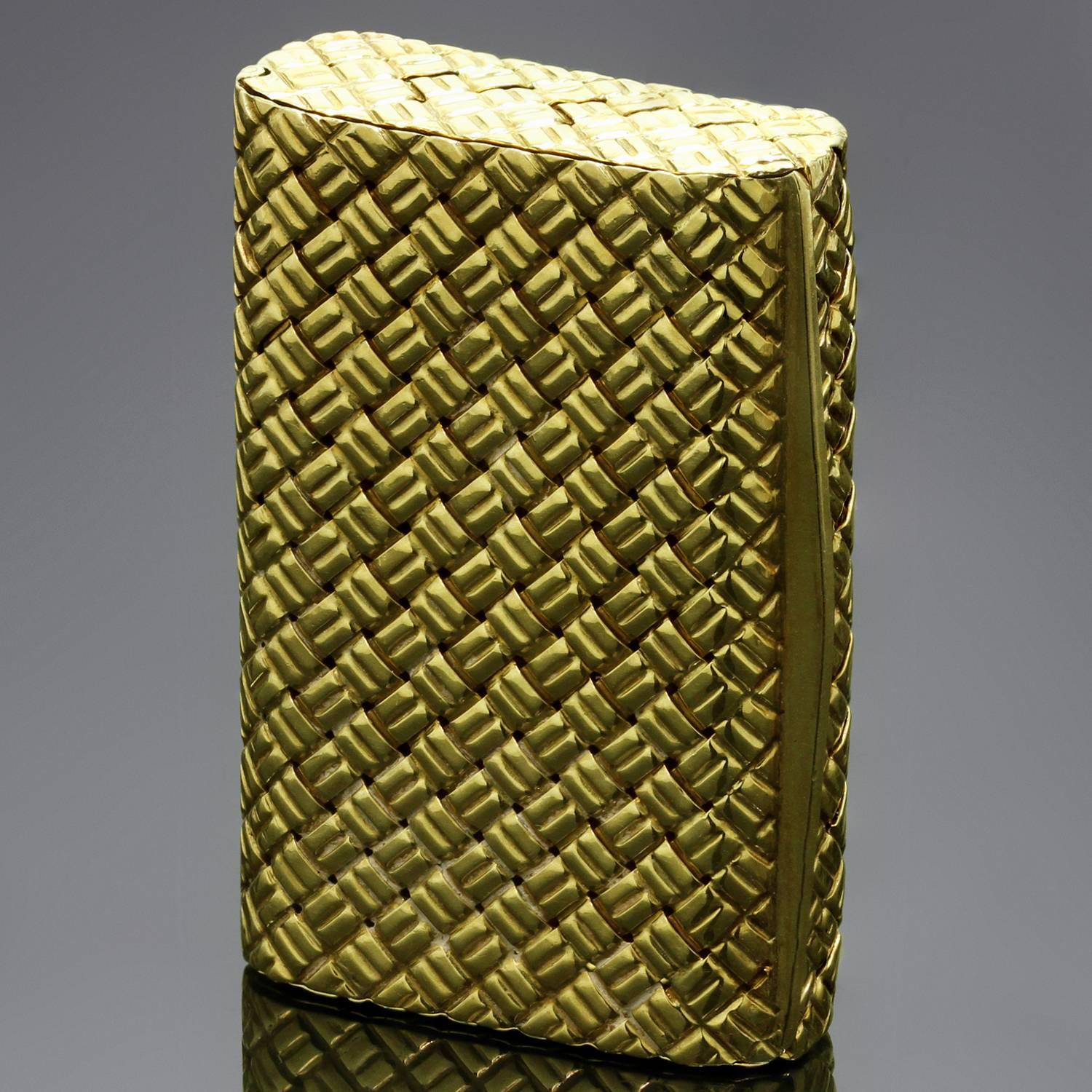 This fabulous Objets d'Art piece from Van Cleef & Arpels Objets d'Art is a fully functional pill box featuring a beautiful woven pattern crafted in 18k yellow gold. Made in France circa 1950s-1960s. Measurements: 1.10