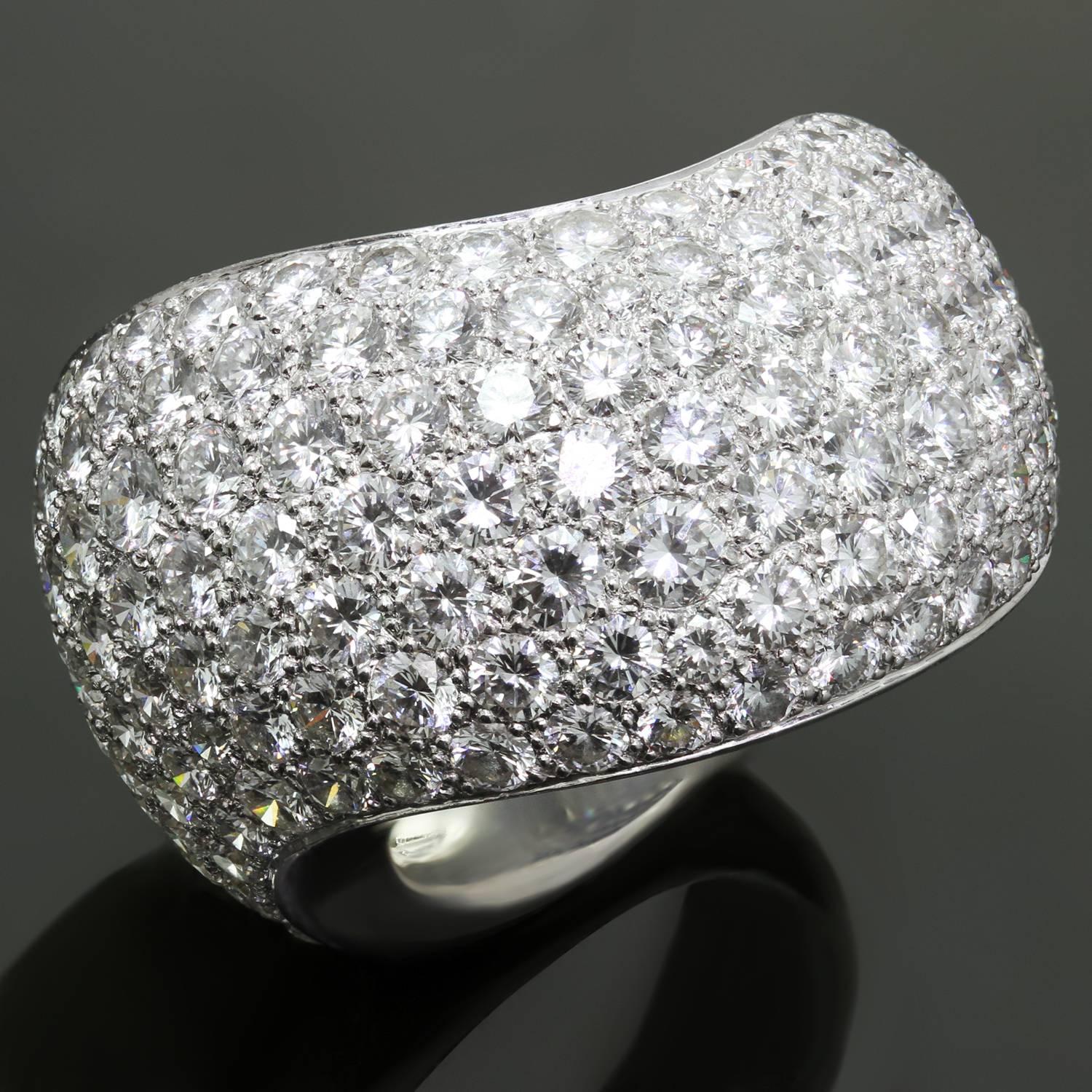 This gorgeous ring from Cartier's Paris Nouvelle Vague collection features a wide slightly swirling band crafted in 18k white gold and pave-set with exquisite brilliant-cut round diamonds of an estimated 5.0 carats. Made in France circa 1999.