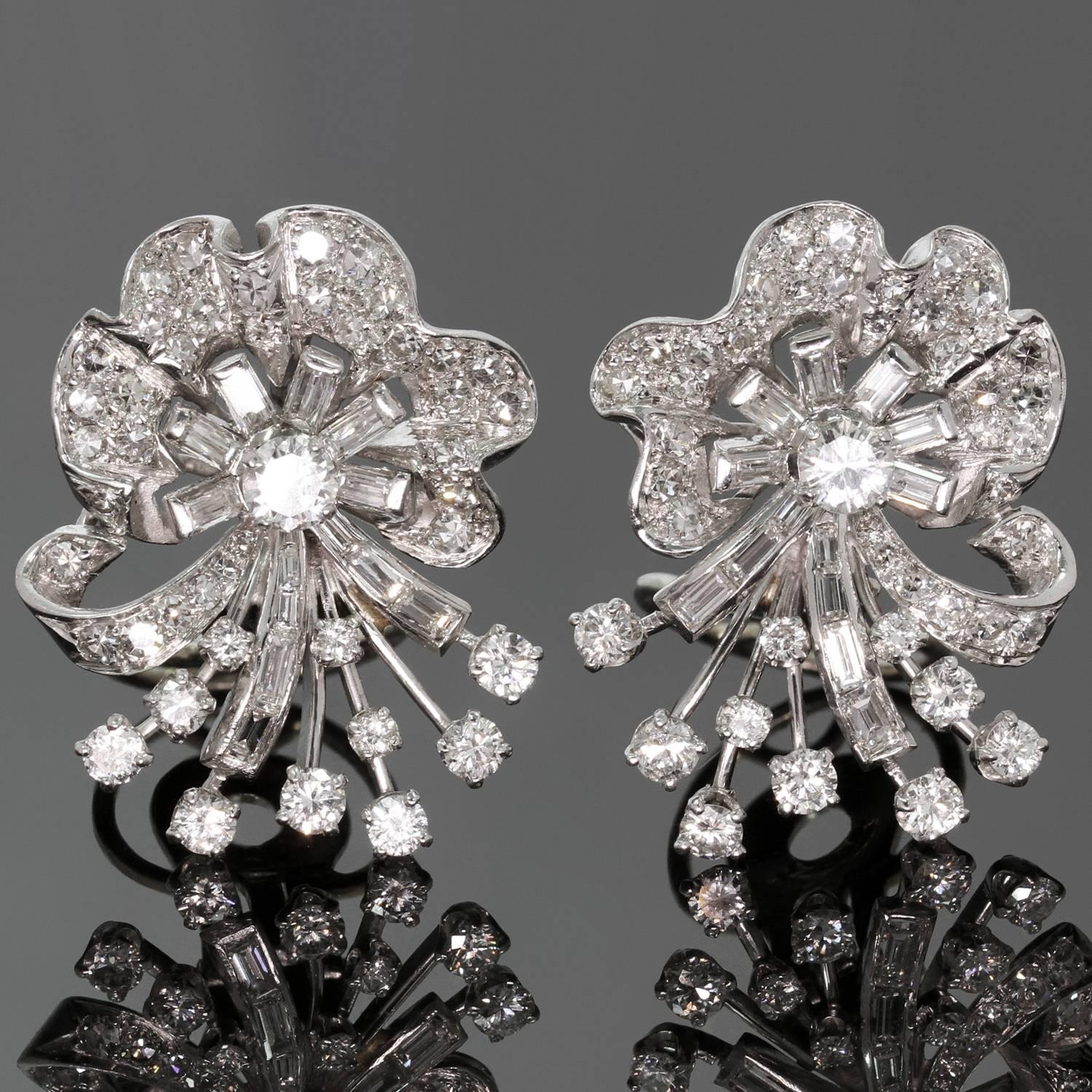 A fabulous holiday adornment! These festive clip-on earrings feature round and baguette-cut diamonds of an estimated 4.45 carats, set in platinum, and completed with custom-made extra large 14k gold omega backs. The earrings tested as platinum and