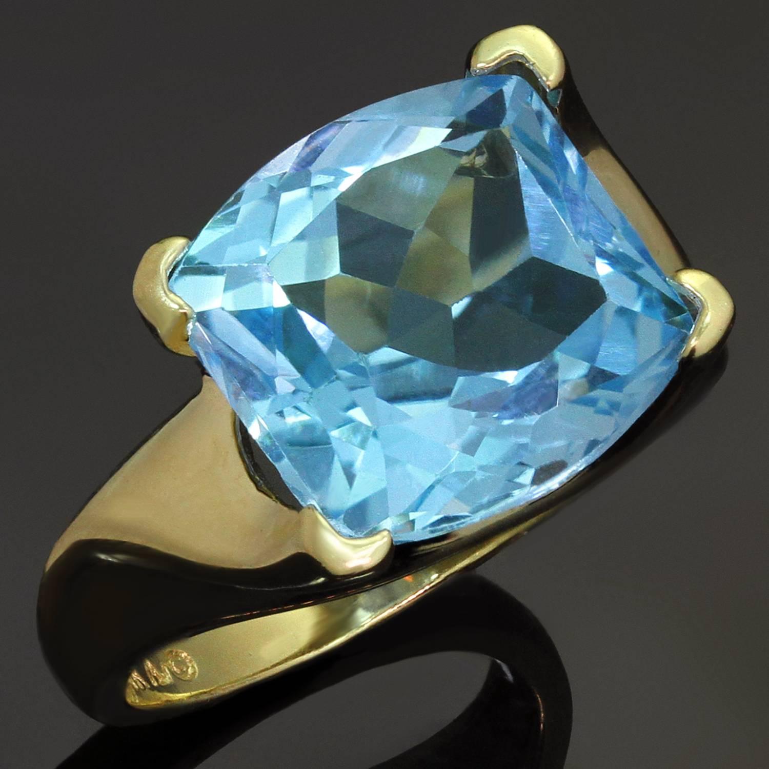 This elegant ring is crafted in 14k white gold and set with a 12.0mm x 12.0mm sparkling laser-cut blue topaz with clear intense blue color. Made in United States circa 2000s. Measurements: 0.55