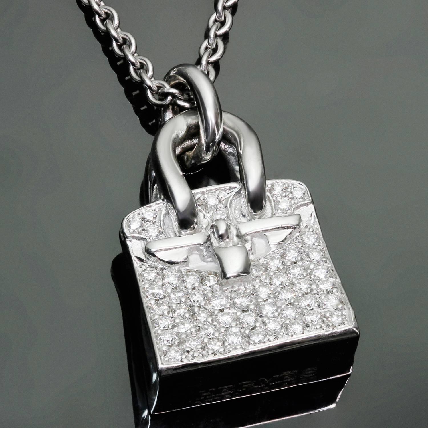 This stunning necklace from the chic Birkin Amulette collection is crafted in 18k white gold and features the iconic Kelly bag shaped pendant set with brilliant-cut round diamonds of an estimated 0.22 carats. Made in France circa 2010s.