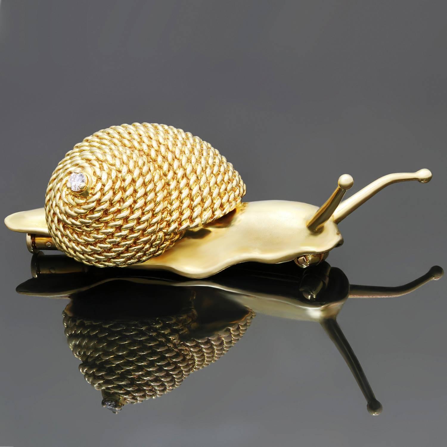 This rare Hermes brooch is crafted in 18k yellow gold in a shape of an adorable snail with high polish details and a textured twisted wire motif accented with a solitaire brilliant-cut round diamond of an estimated 0.04 carats. Signed Hermes, Paris