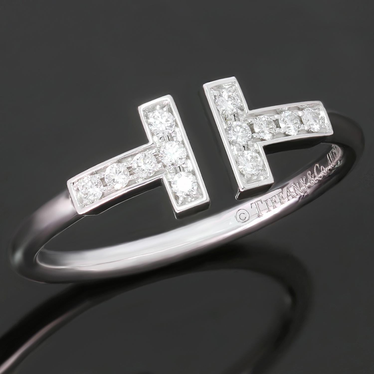 This gorgeous modern Tiffany ring is crafted in 18k white gold and set with brilliant-cut round diamonds. The Tiffany T Wire collection features graphic angles, clean lines, and dazzling diamonds accentuating the ring's bold and timeless form. Made