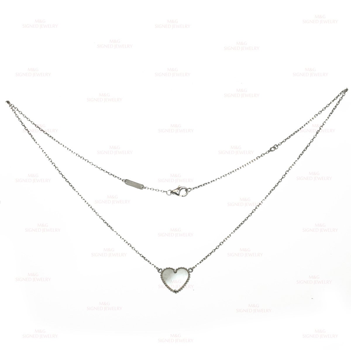 This romantic Van Cleef & Arpels necklace is made in 18k white gold and accented with a heart-shaped mother-of-pearl pendant. Made in France circa 2000s. Measurements: 0.47