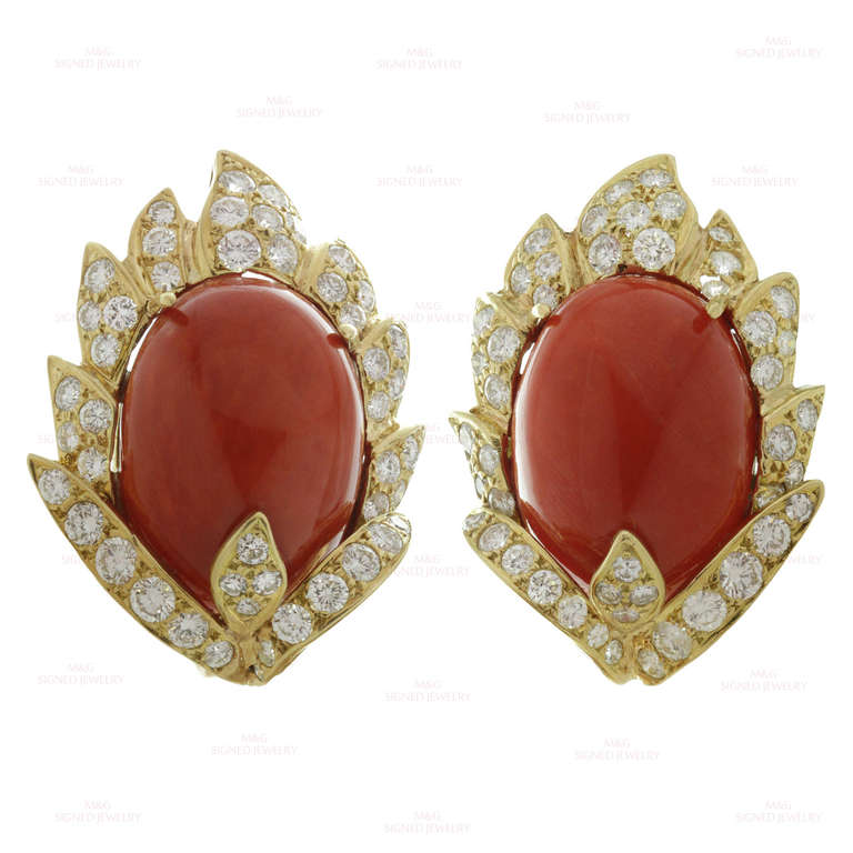 Gorgeous 18k yellow gold vintage earrings designed by Vourakis, a renowned jeweler who worked for Van Cleef & Arpels in 1950s and 1960s. These clip-on earrings are set with natural oval oxblood coral stones measuring 15.0mm x 19.0mm and