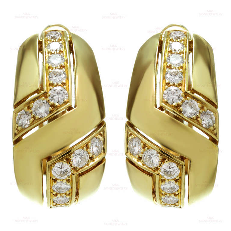 The name Cartier is synonymous with sophistication. These stunning earrings are made from 18k yellow gold and feature an estimated 1.85 carats of sparkling round F-G VS1-VS2 diamonds dispersed in two "L" shapes.