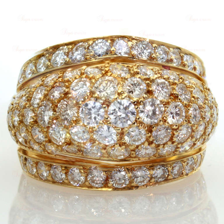 This fabulous classic Cartier dome band features 87 round sparkling round E-F VVS2-VS1 diamonds (an estimated 3.9 carats) pave-set in 18k yellow gold. Timeless and glamorous. Estimated Retail Value is $26,000. Ring Size	is 7.25 - EU 55, resizable,