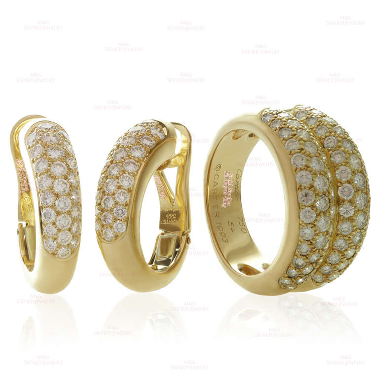 This iconic Cartier jewelry set consists of clip-on oval hoop earrings and two-row domed band made in 18k yellow gold and pave-set with brilliant-cut round F-G VVS2-VS1 diamonds. The ring is set 80 diamonds of an estimated 2.50 carats and the